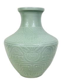 A CELADON CARVED PLANTAIN-LEAF LEI-FORM ZUN