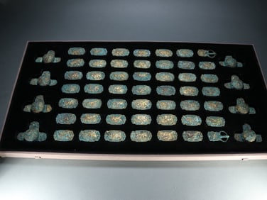 Group of Fifty Seven Gilt Bronze Carved Character and Beast Pattern Ornament