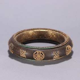 Pair of Agarwood Inlaid Gilt Silver Carved Shou Pattern Bangle