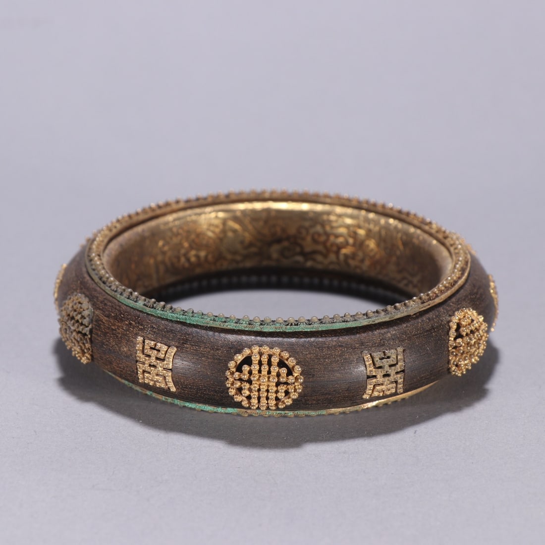 Pair of Agarwood Inlaid Gilt Silver Carved Shou Pattern Bangle: Pair of Agarwood Inlaid Gilt Silver Carved Shou Pattern Bangle (6 x 1.9cm)