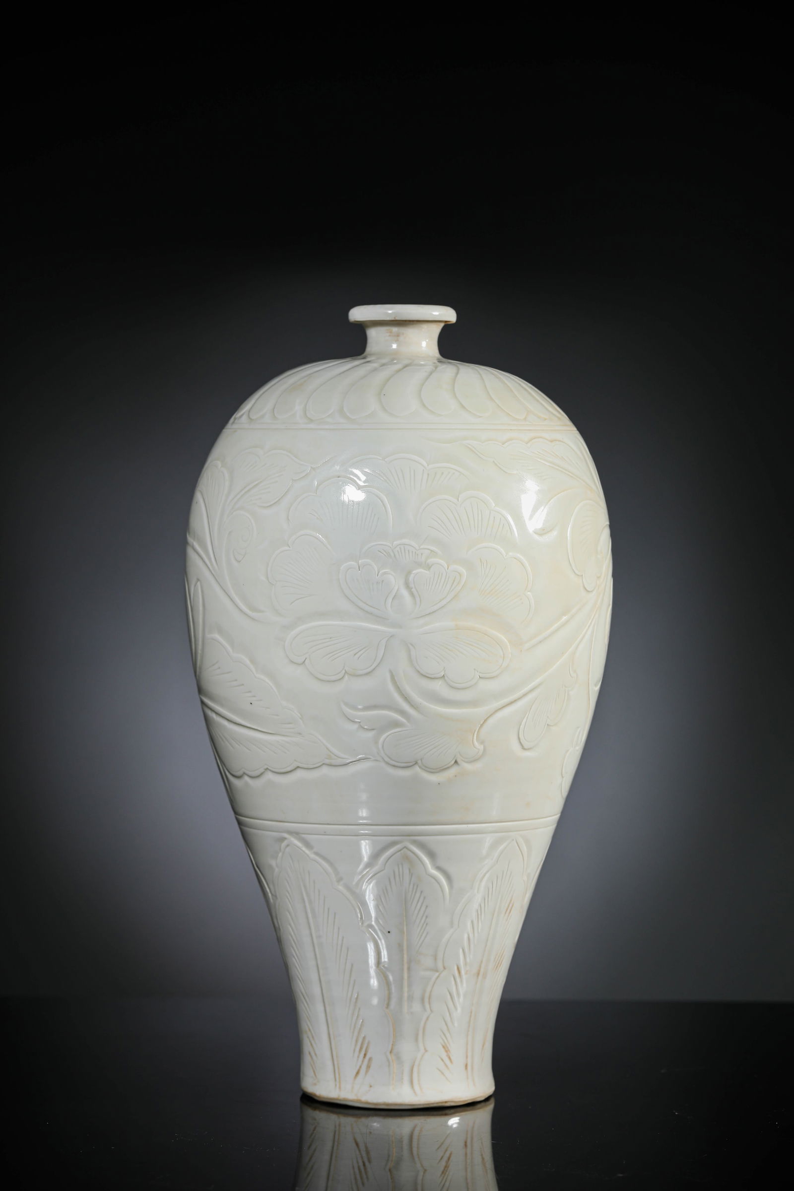A White Porcelain 'Carved Peony' Meiping: A White Porcelain 'Carved Peony' Meiping (15.4 x 28.3cm)