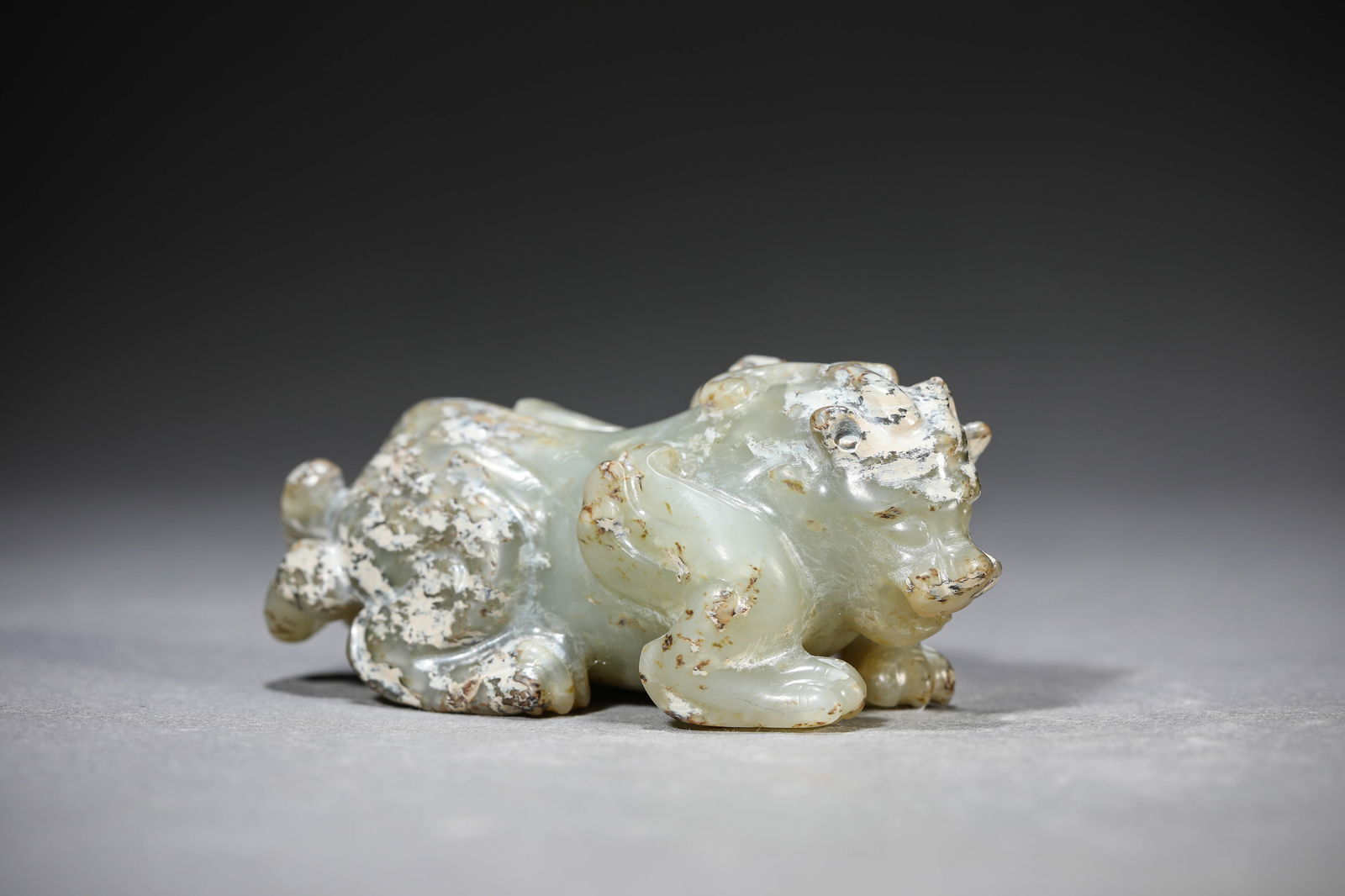 A Jade ‘Auspicious Beast’ Ornament: A Jade ‘Auspicious Beast’ Ornament (8 x 4.1 x 3.5cm)
