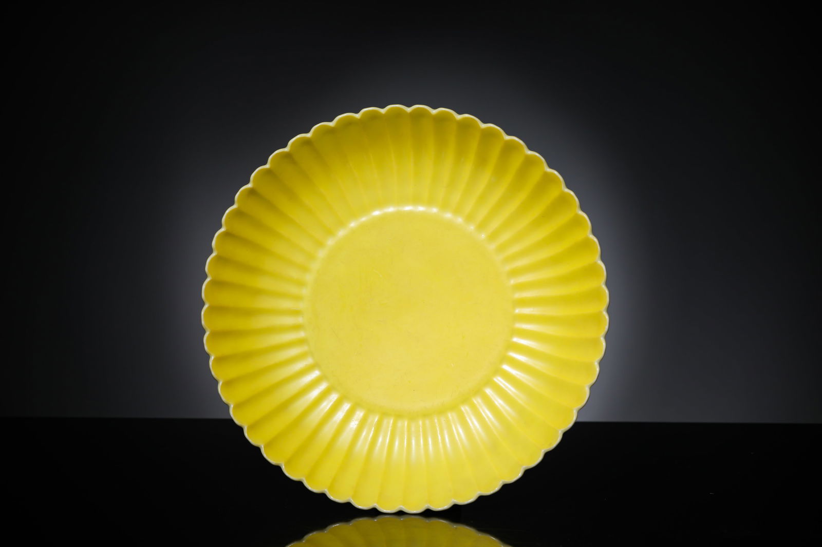 A Lemon-Yellow-Glazed 'Chrysanthemum-Petal' Dish: A Lemon-Yellow-Glazed 'Chrysanthemum-Petal' Dish (18.6 x 4.1cm)