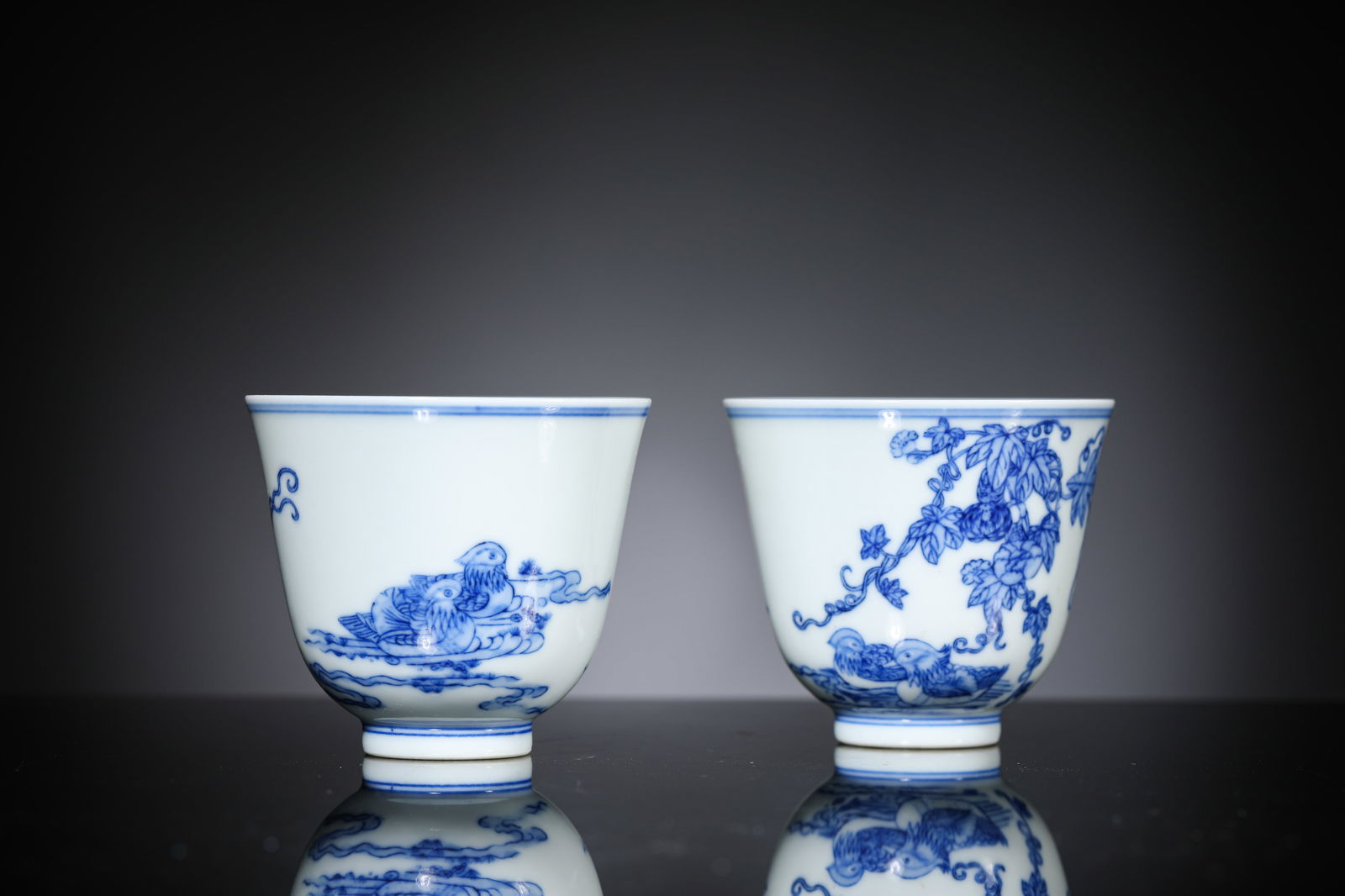 A Pair of Blue and White ‘Flowers, Fruit and Mandarin Ducks’ Cups: A Pair of Blue and White ‘Flowers, Fruit and Mandarin Ducks’ Cups (6.9 x 6.2cm)
