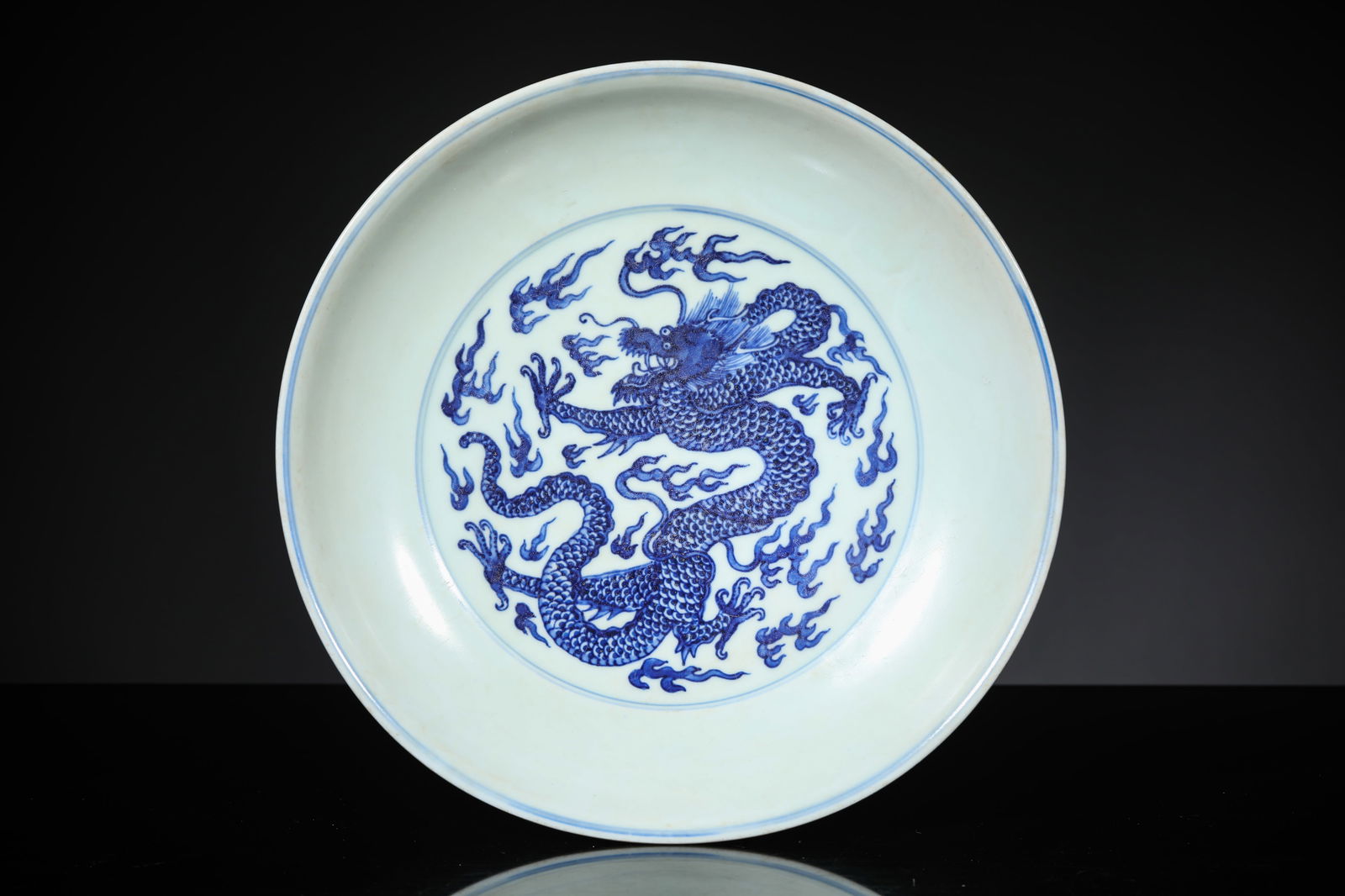 A Blue and White 'Dragon, Bat and Shou' Dish: A Blue and White 'Dragon, Bat and Shou' Dish (26.2 x 4.4cm)