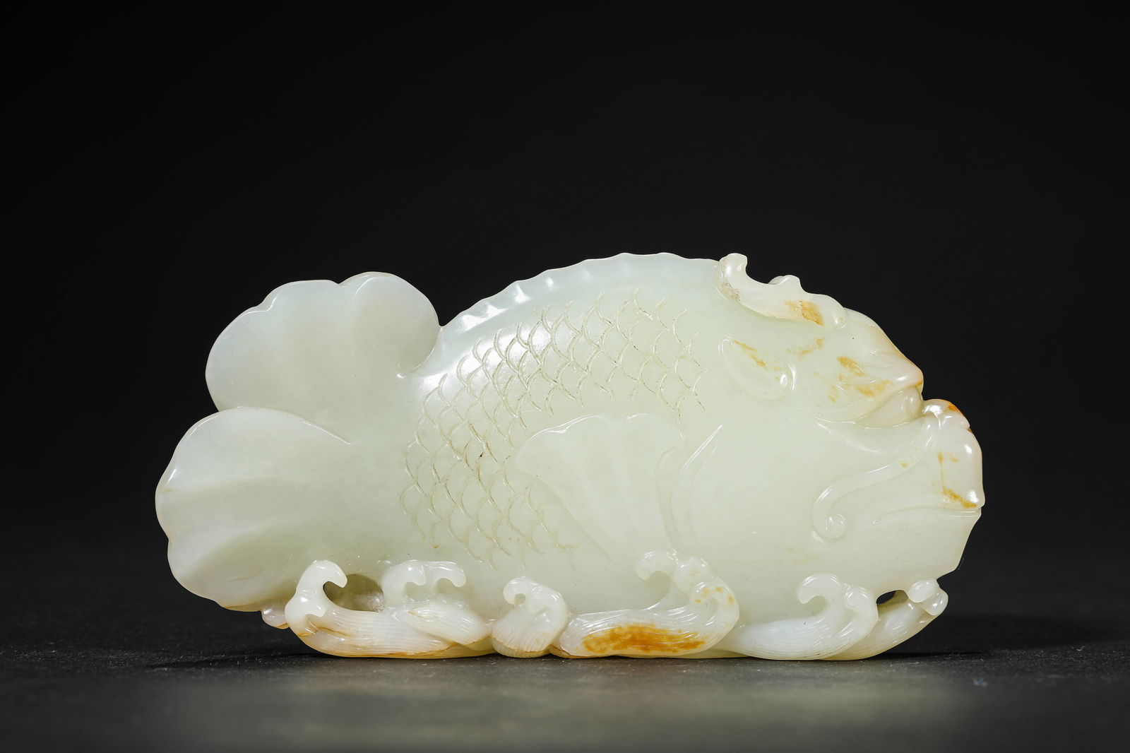 A Jade Fish: A Jade Fish (14 x 2.8 x 6.8cm)