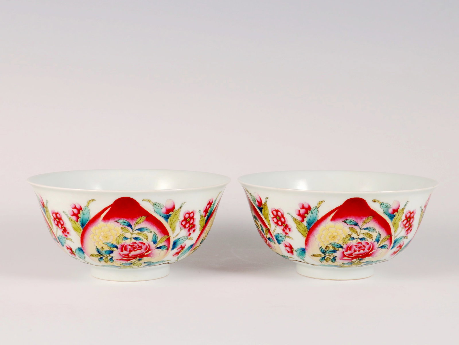 A PAIR OF ENAMEL 'FLOWER AND PEACH' BOWLS (1 of 9)