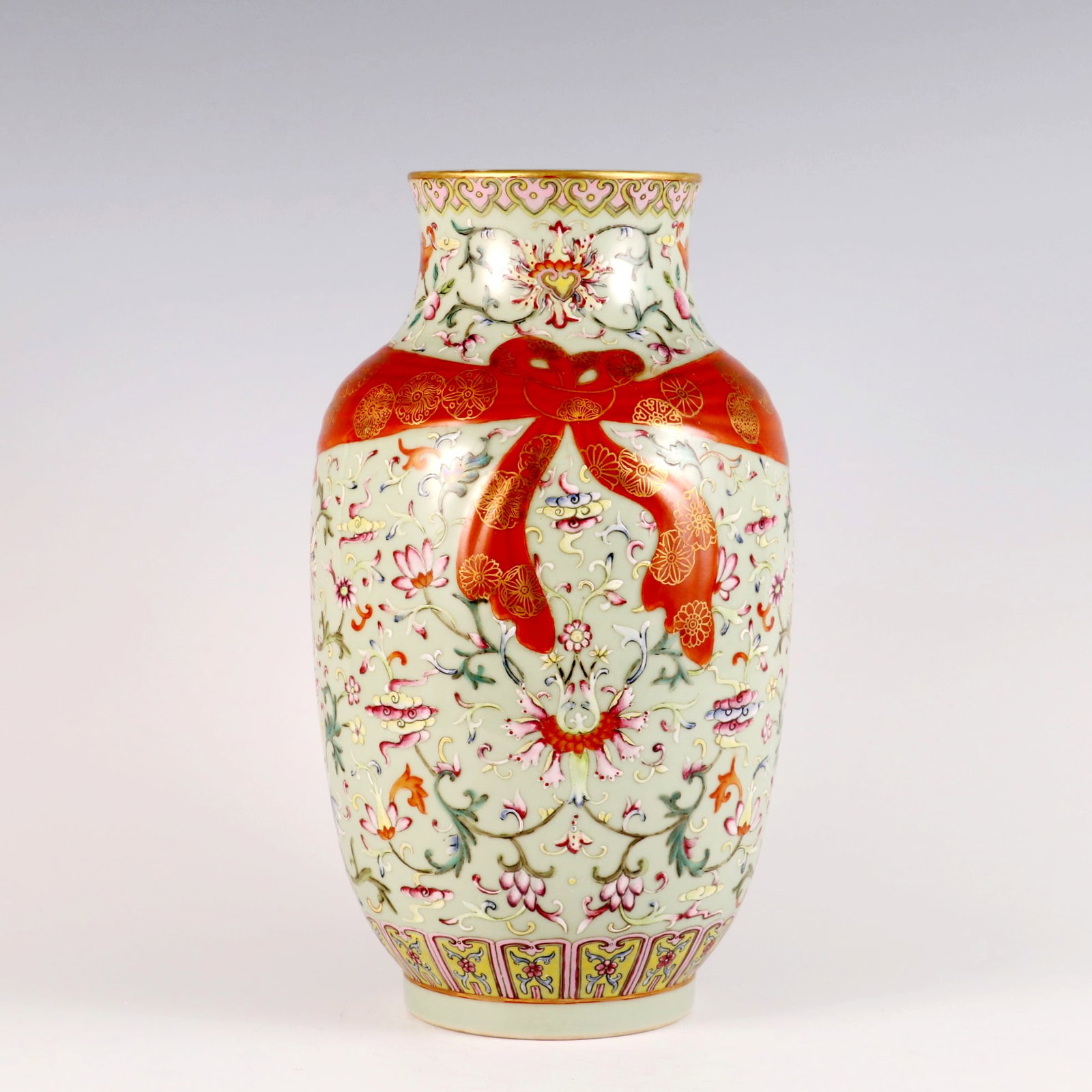 A CELADON-GLAZED AND FAMILLE ROSE 'INTERLOCKING LOTUS' RIBBON VASE (1 of 9)