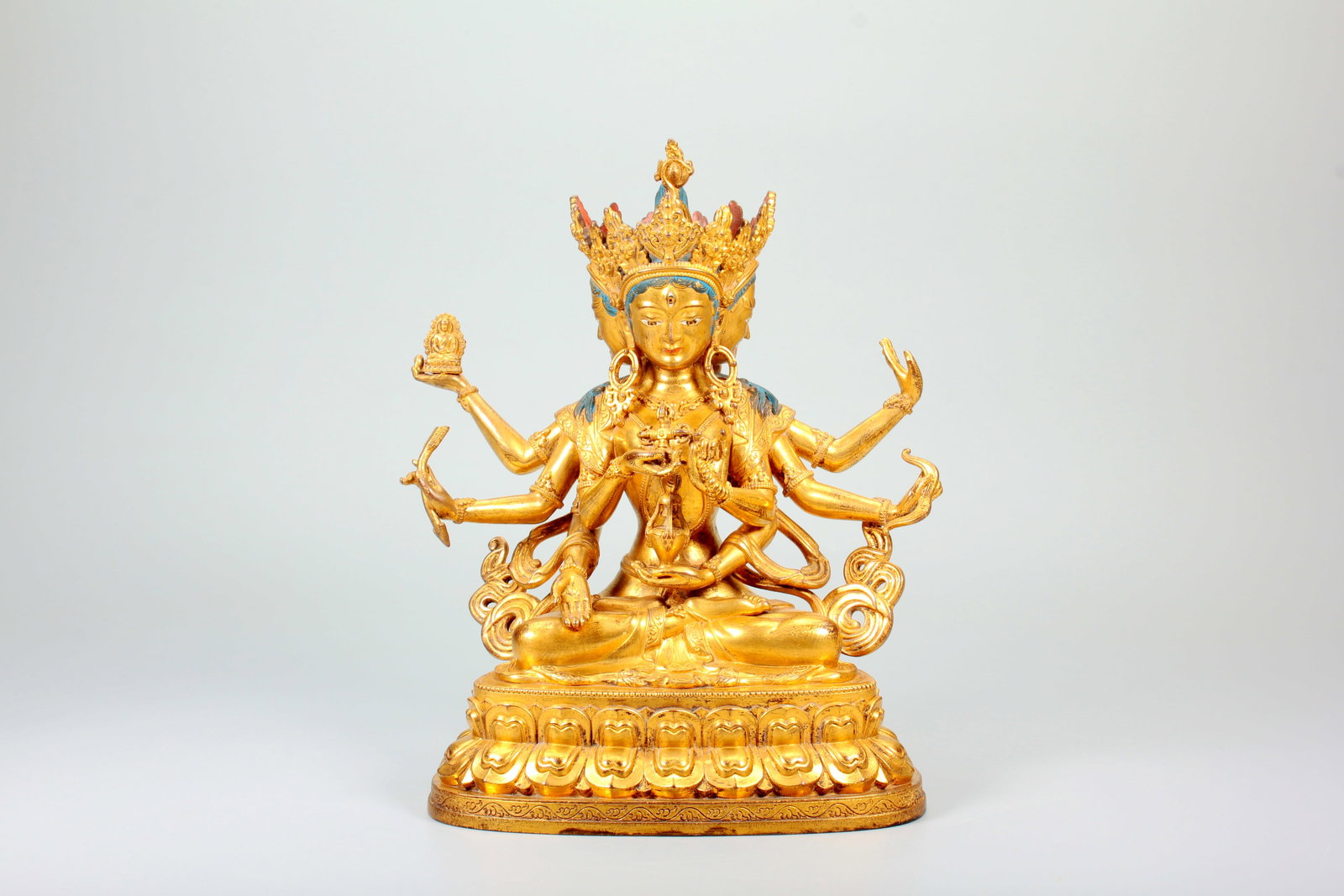 A COPPER GILT THREE-FACED EIGHT-ARMED USHNISHAVIJAYA BODHISATTVA STATUE (1 of 20)