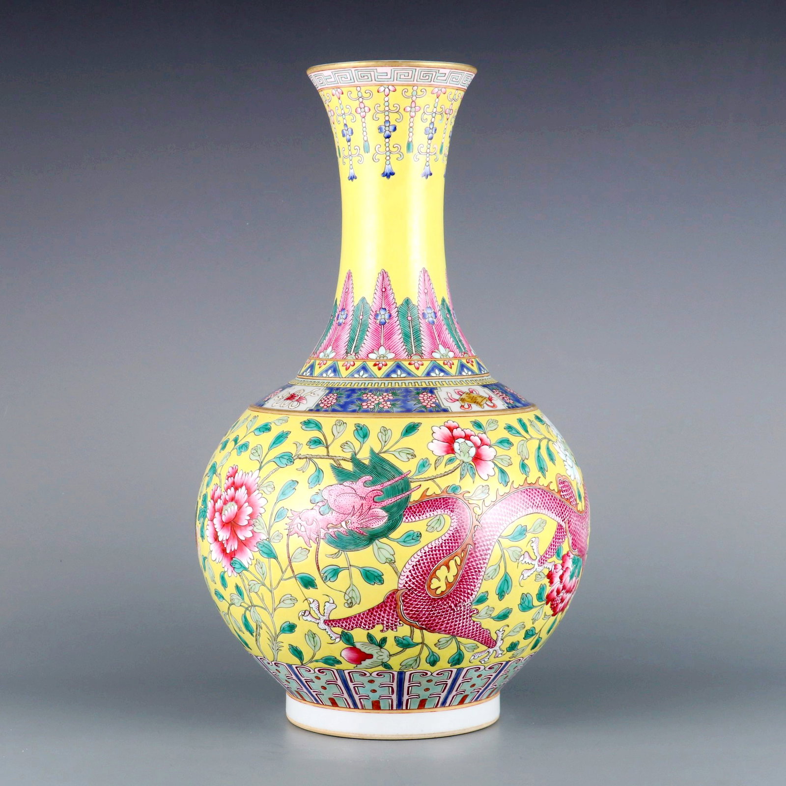 A YELLOW-GROUND FAMILLE ROSE 'DRAGON-PHOENIX AMONG FLOWERS' DECORATIVE VASE (1 of 9)