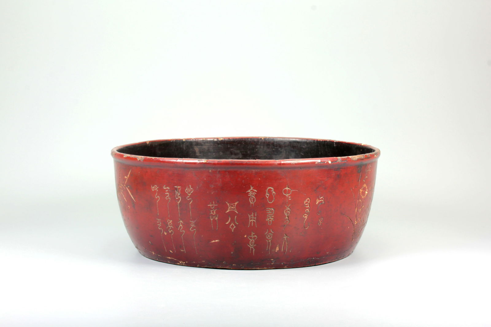 A RED LACQUER ORCHID AND CHRYSANTHEMUM PATTERN POEM BOWL (1 of 14)