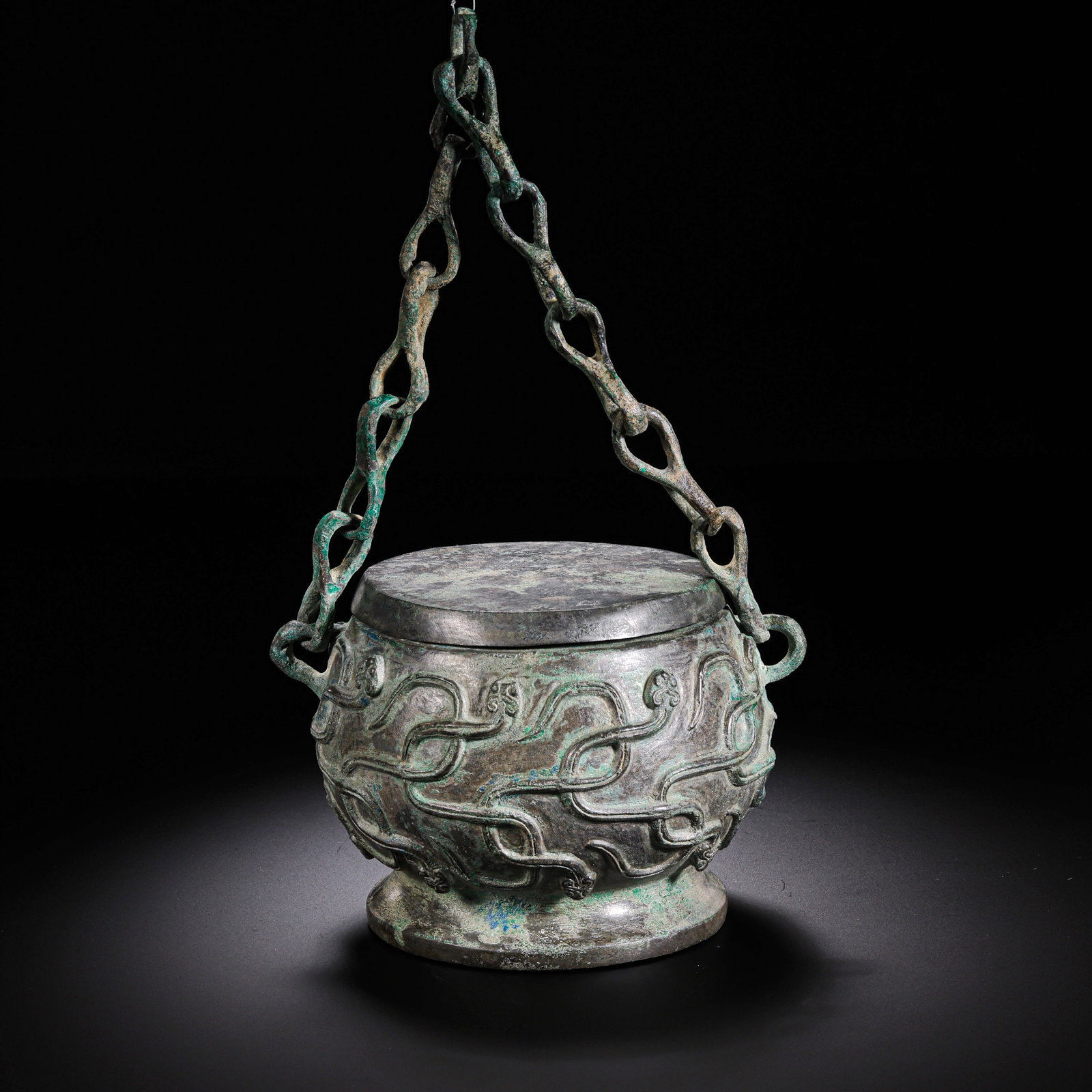 A SPRING AND AUTUMN PERIOD BRONZE HANDLE CHAIN BURNER: A SPRING AND AUTUMN PERIOD BRONZE HANDLE CHAIN BURNER H:8CM,W:13CM