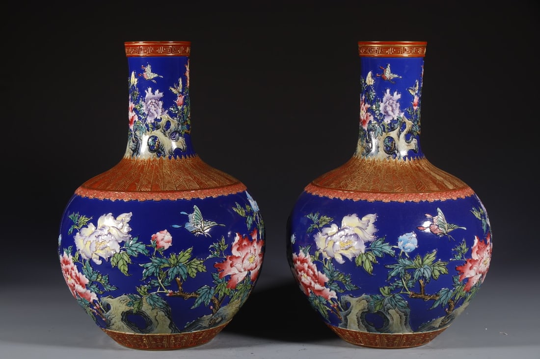 Pair of Blue Glazed Carved Flower with Butterfly Pattern Porcelain Tianqiu Vase: Pair of Blue Glazed Carved Flower with Butterfly Pattern Porcelain Tianqiu Vase (33 x 10cm)
