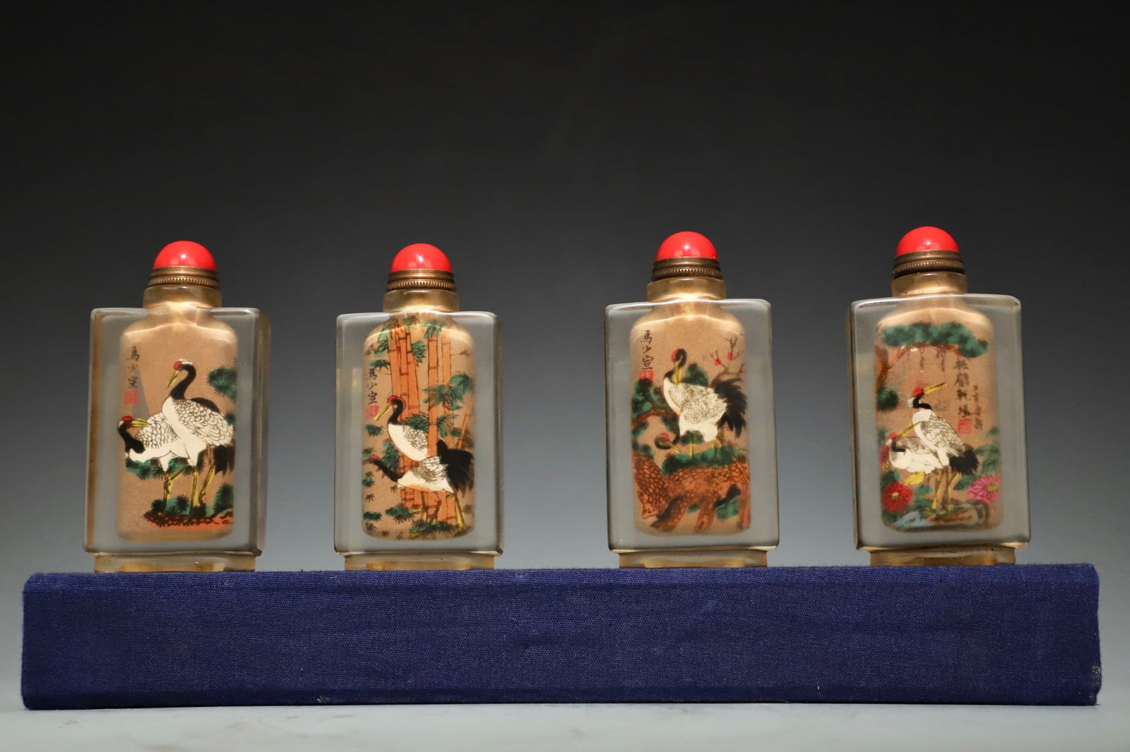 Group of Four White Crystal Colour Painted Pine Tree and Crane Pattern Snuff Bottle: Group of Four White Crystal Colour Painted Pine Tree and Crane Pattern Snuff Bottle (8.5 x 4 x 2cm)