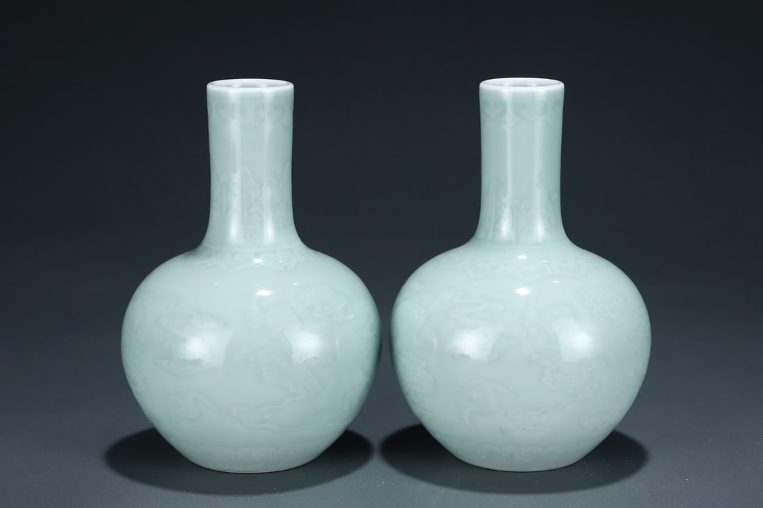 Pair of Bean Green Glazed Carved Cloud Pattern Porcelain Tianqiu Vase: Pair of Bean Green Glazed Carved Cloud Pattern Porcelain Tianqiu Vase (17.5 x 12.3cm)