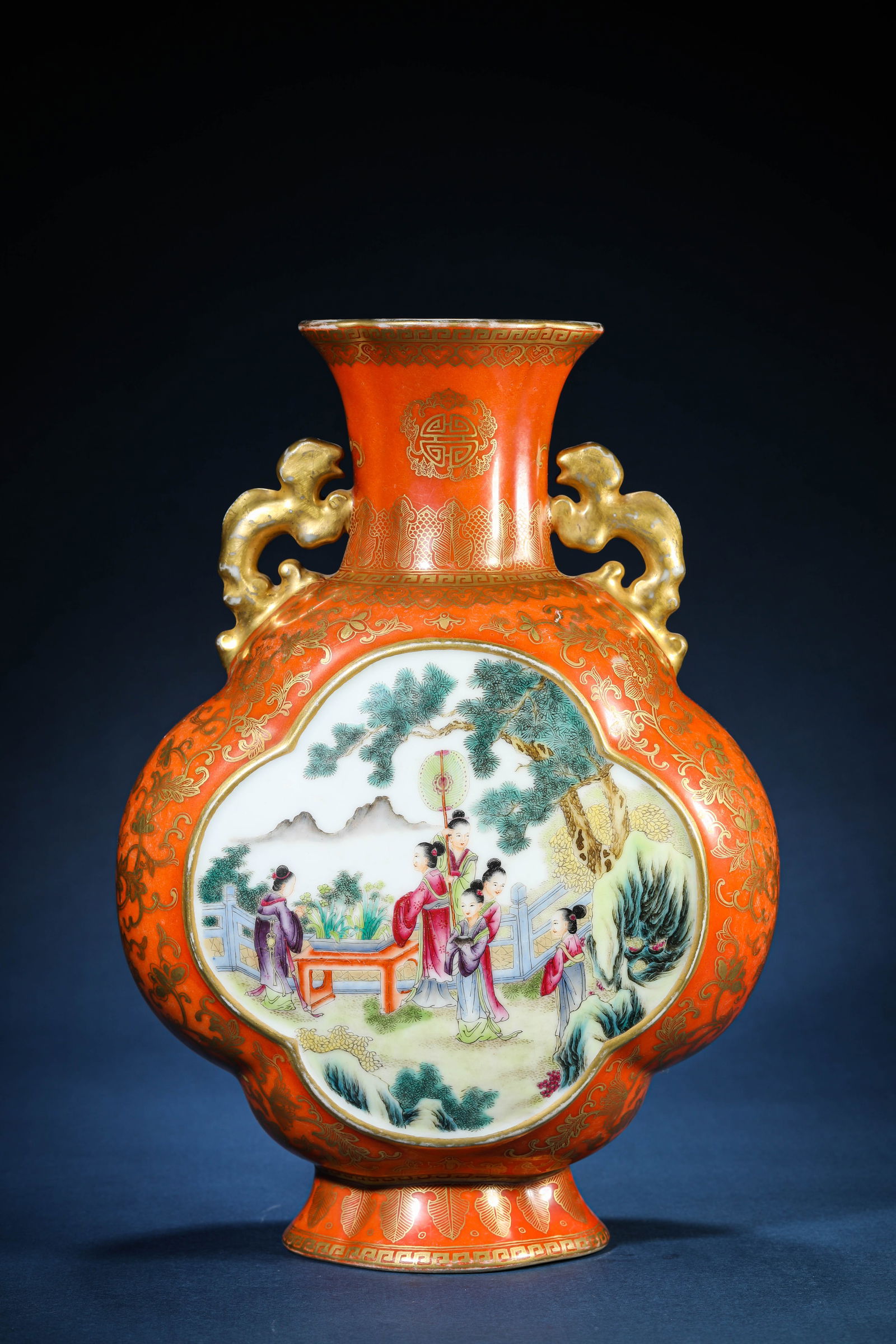 A Coral-Red-Ground Gilt-Decorated 'Floral Reserves and Famille-Rose Figures' Vase: A Coral-Red-Ground Gilt-Decorated 'Floral Reserves and Famille-Rose Figures' Vase (24.6 x 13.6 x 35.4 cm)