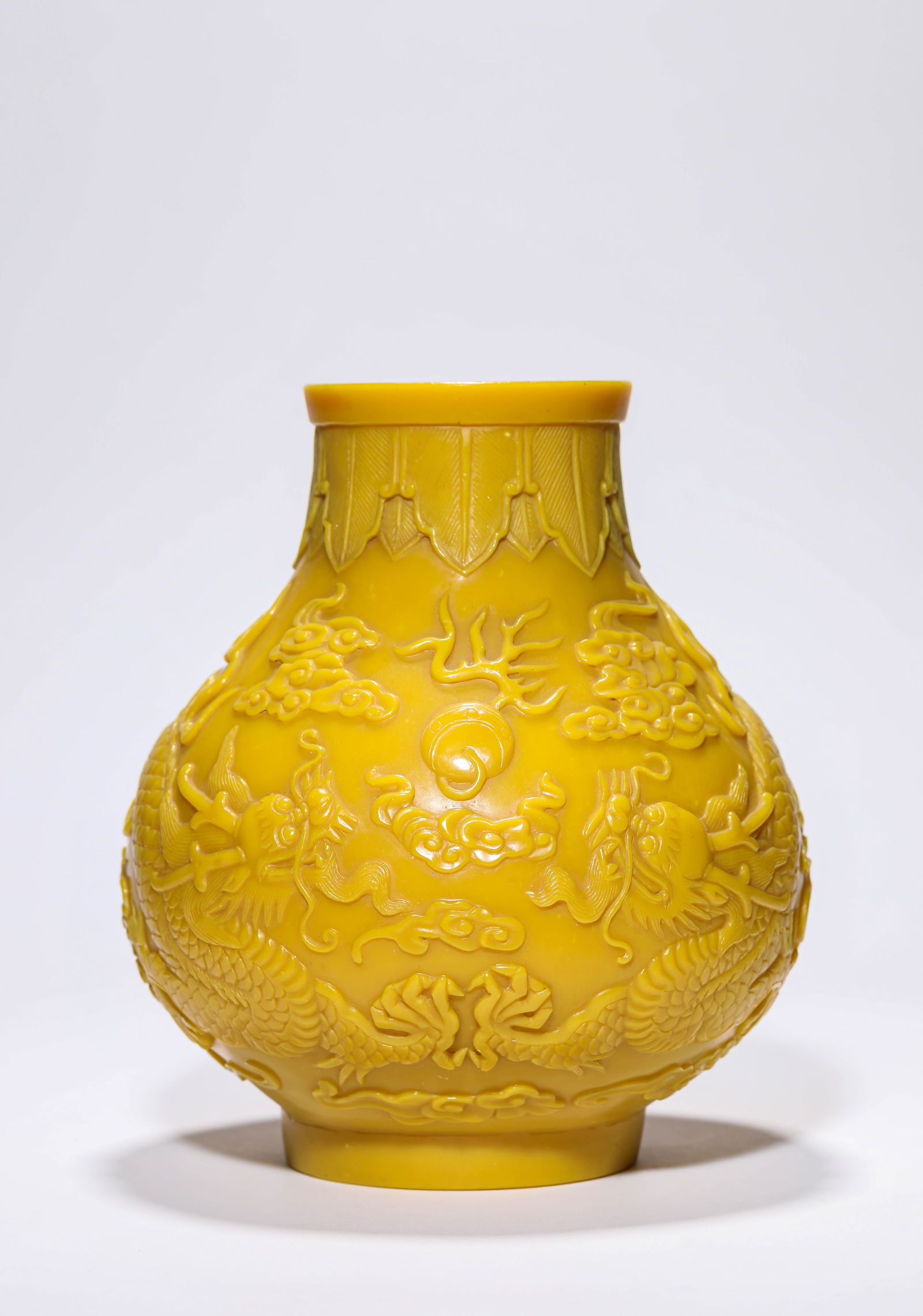 A Yellow-Glass 'Two Dragons Chasing a Pearl' Vase: A Yellow-Glass 'Two Dragons Chasing a Pearl' Vase (17.8 x 20 cm)