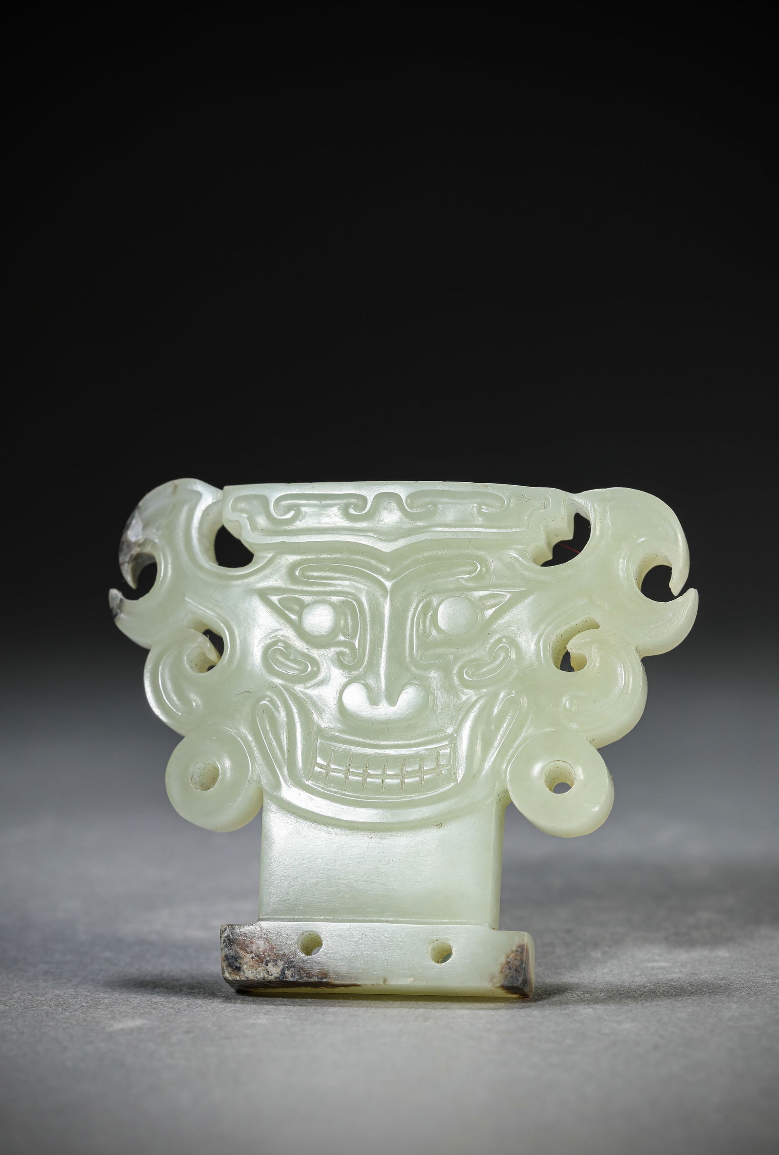 A Jade 'Animal Mask' Ornament: A Jade 'Animal Mask' Ornament (6.5 x 5.5 cm)