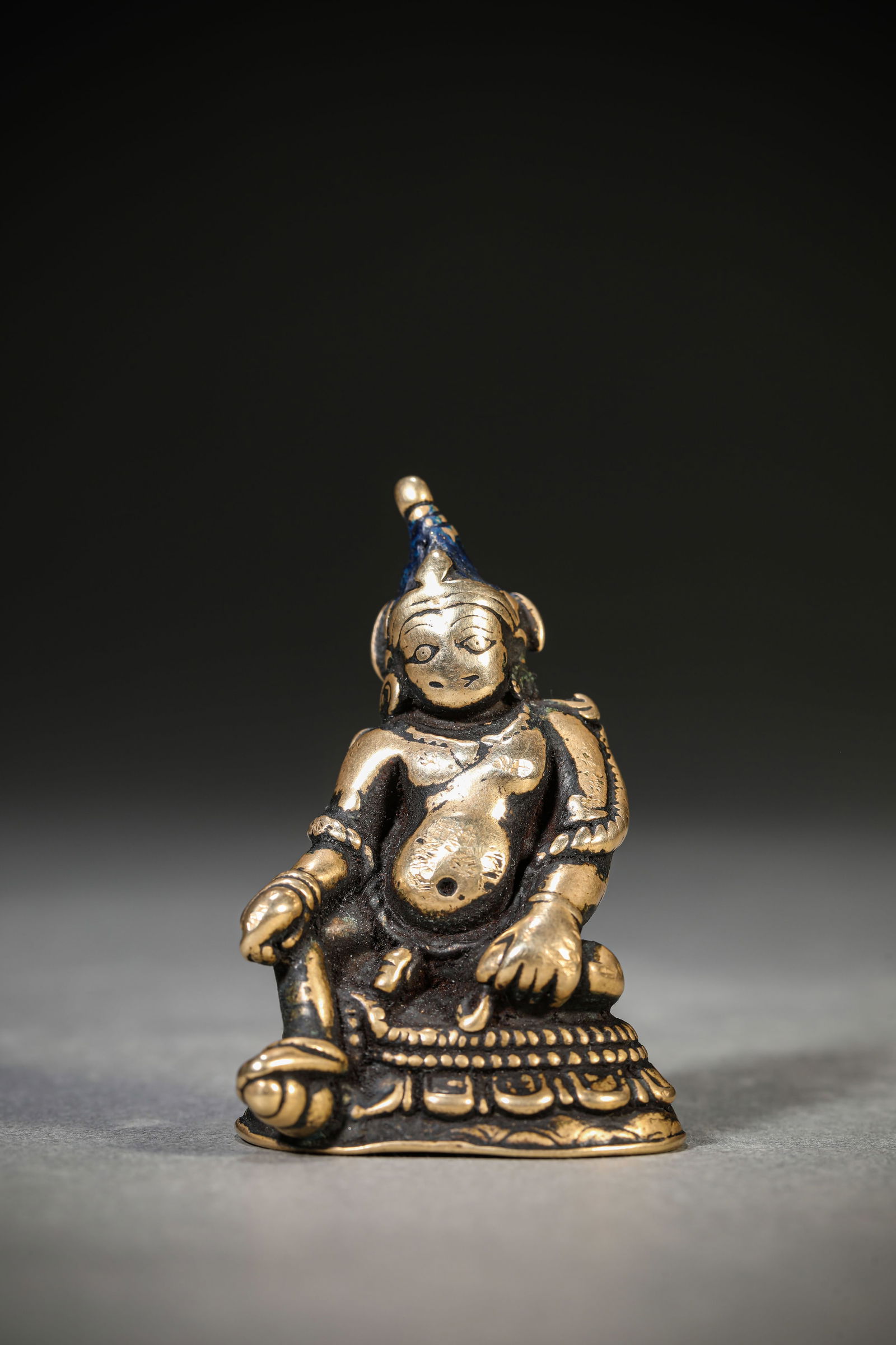 A 'Pala-Style' Figure of Yellow Jambhala: A 'Pala-Style' Figure of Yellow Jambhala (3.8 x 2.8 x 5.5 cm, Weight: 93 grams)