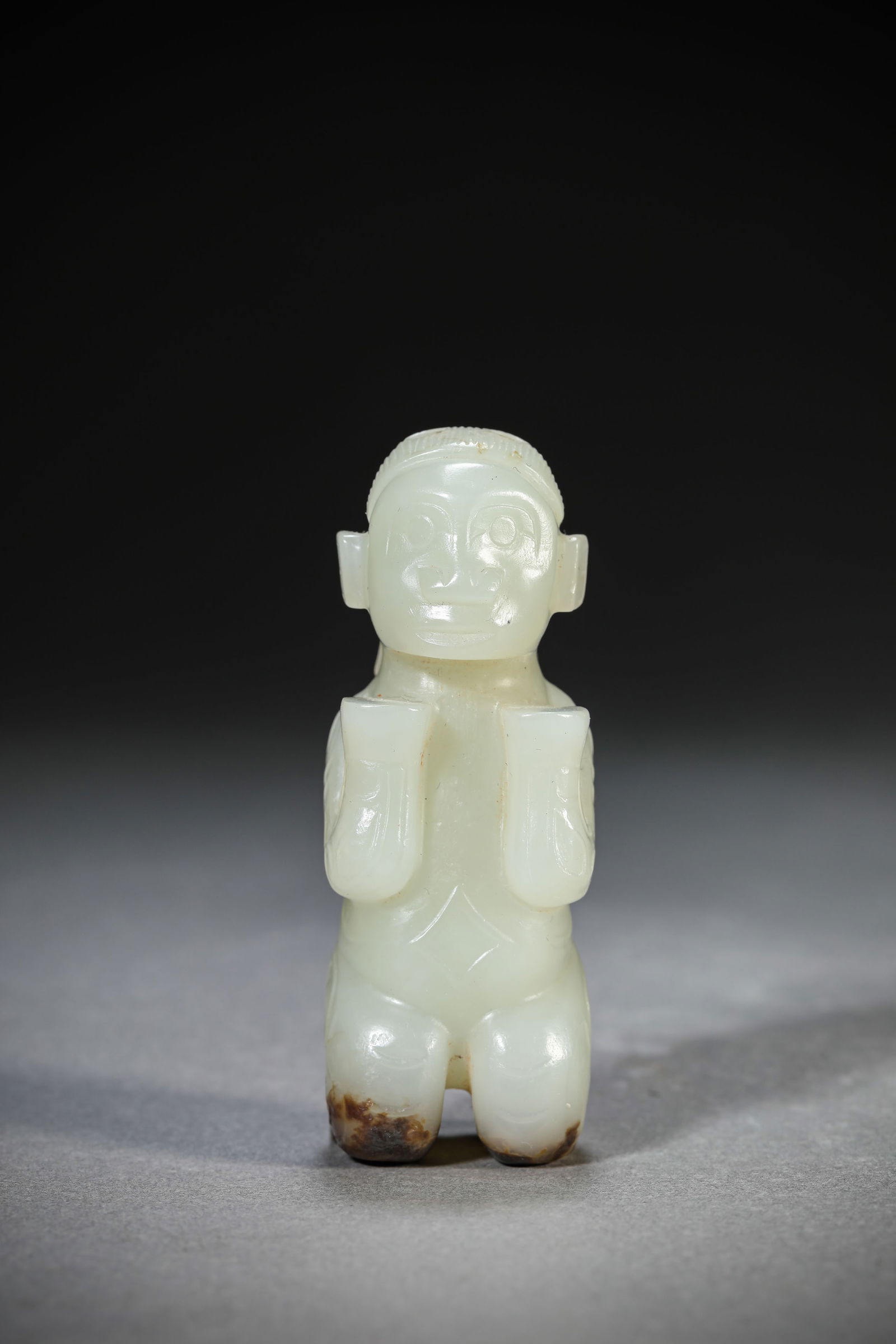 A Jade 'Kneeling Figure': A Jade 'Kneeling Figure' (2.7 x 2.5 x 7.4 cm)