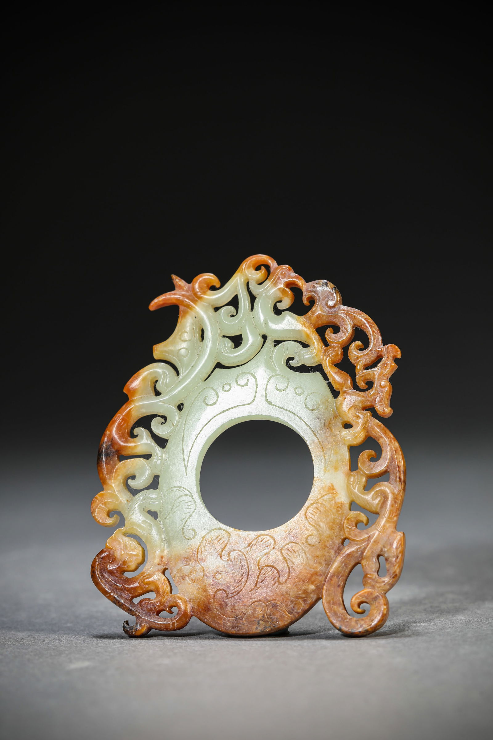 A Jade 'Heart-Shaped' Pendant: A Jade 'Heart-Shaped' Pendant (5.5 x 6.7 cm)