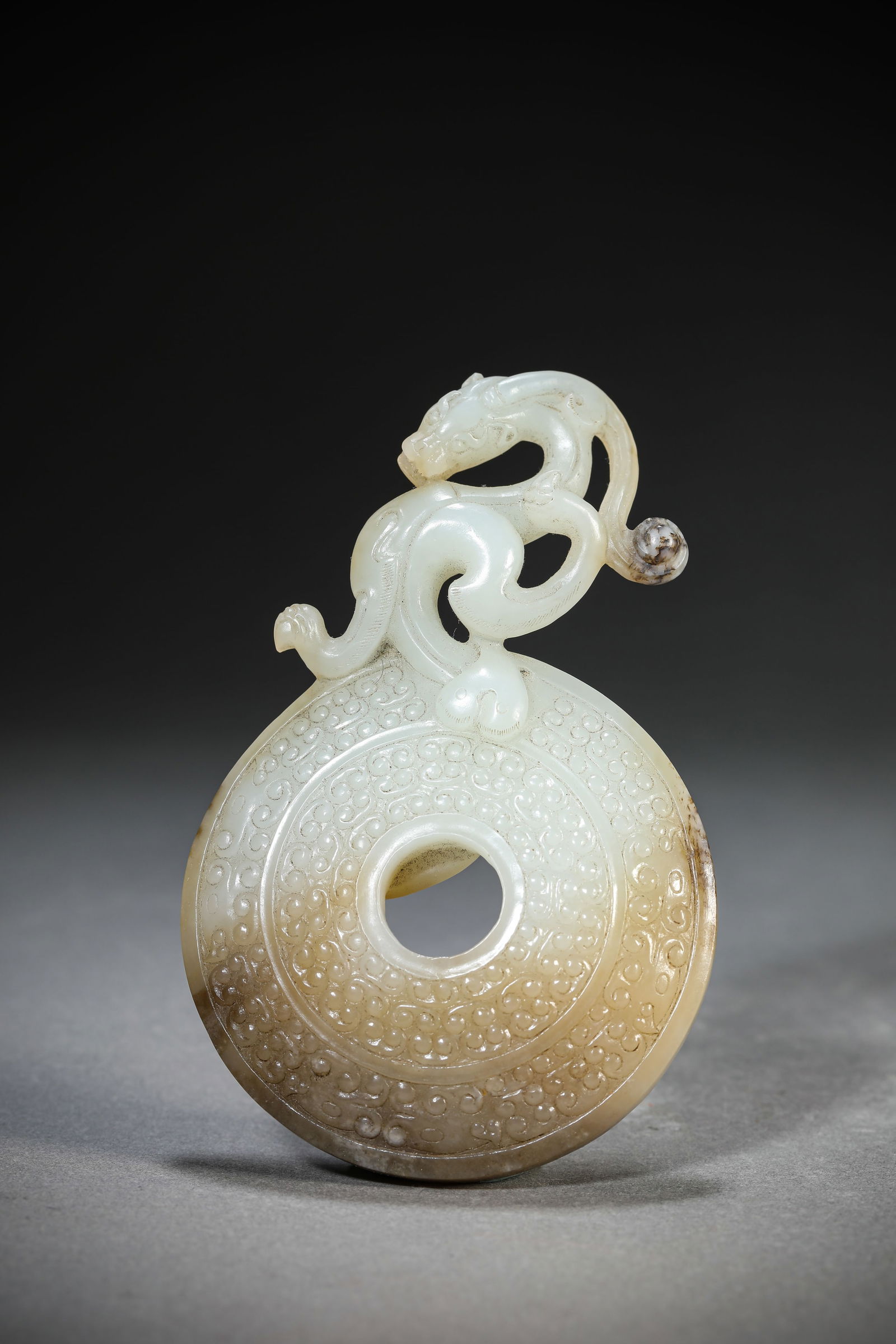 A Jade 'Dragon' Pendant: A Jade 'Dragon' Pendant (6.7 x 10.5 cm)