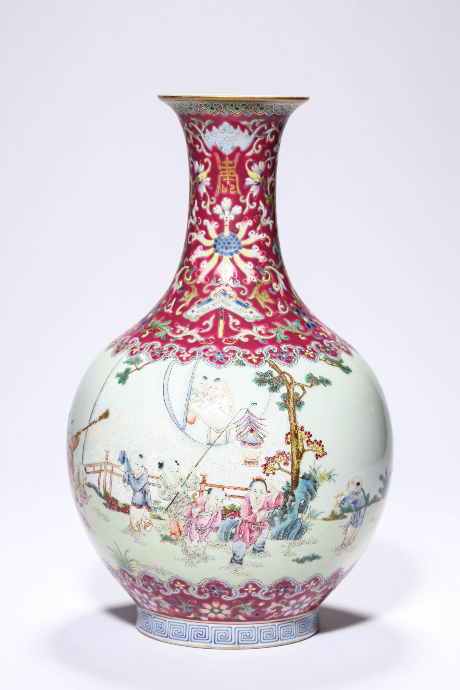 A Rouge-Ground Famille-Rose 'Children at Play' Vase: A Rouge-Ground Famille-Rose 'Children at Play' Vase (17.2 x 30 cm)
