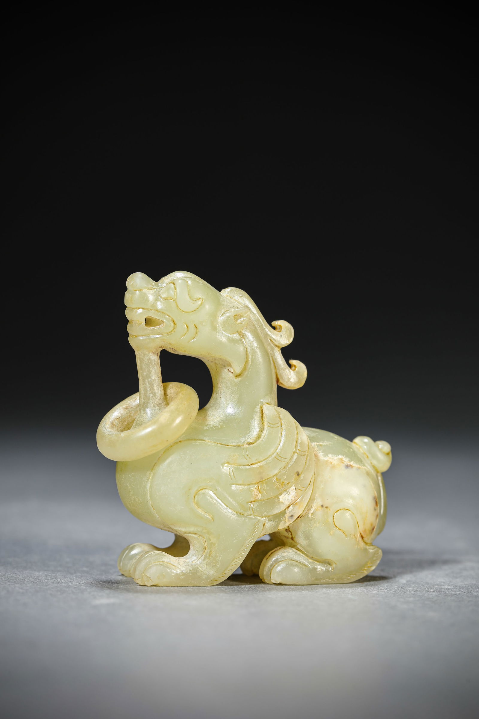 A Jade 'Auspicious Beast': A Jade 'Auspicious Beast' (5 x 2.1 x 5.3 cm)
