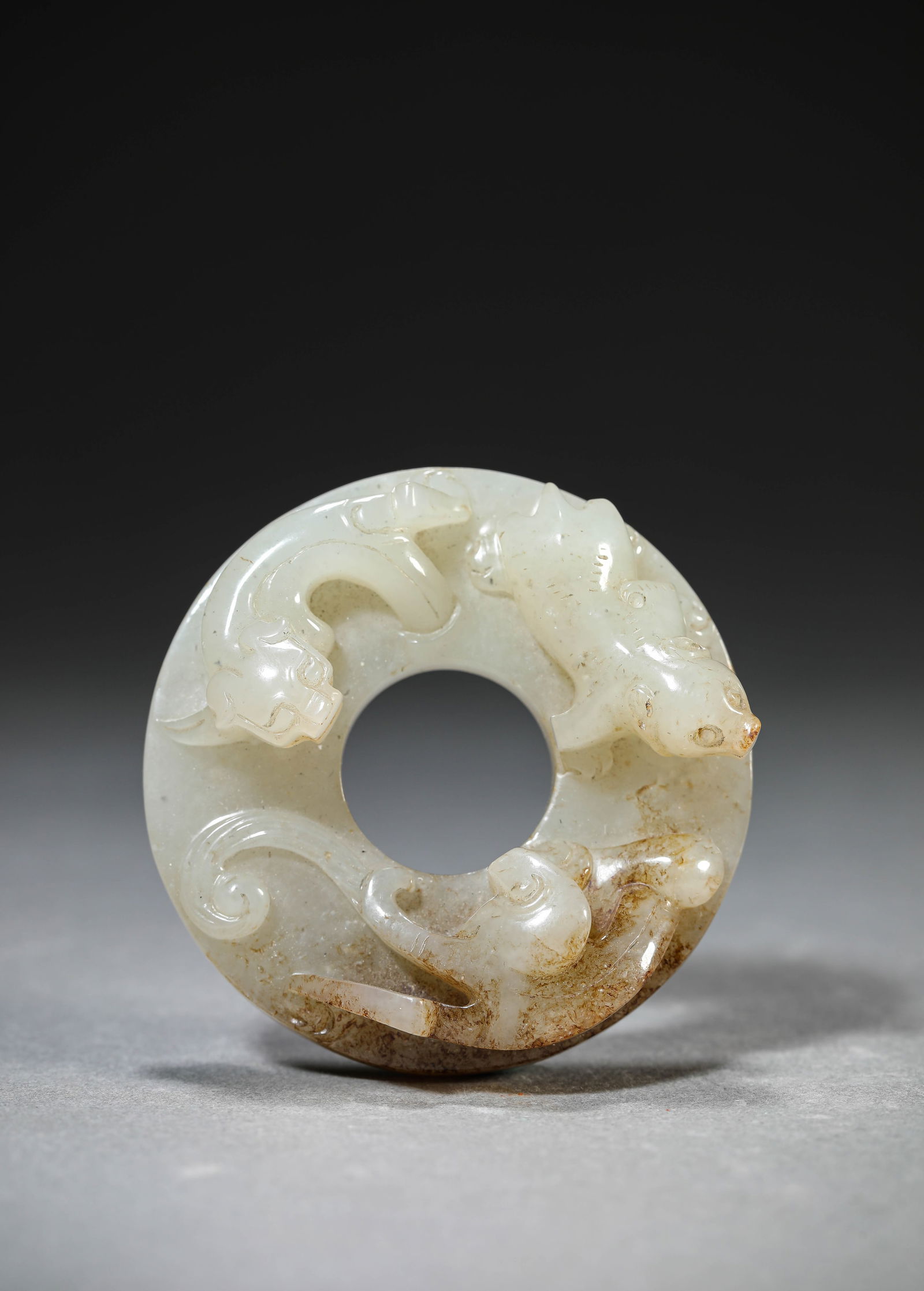A Jade 'Chi-Dragon' Bi Disc: A Jade 'Chi-Dragon' Bi Disc (6 x 2 cm)