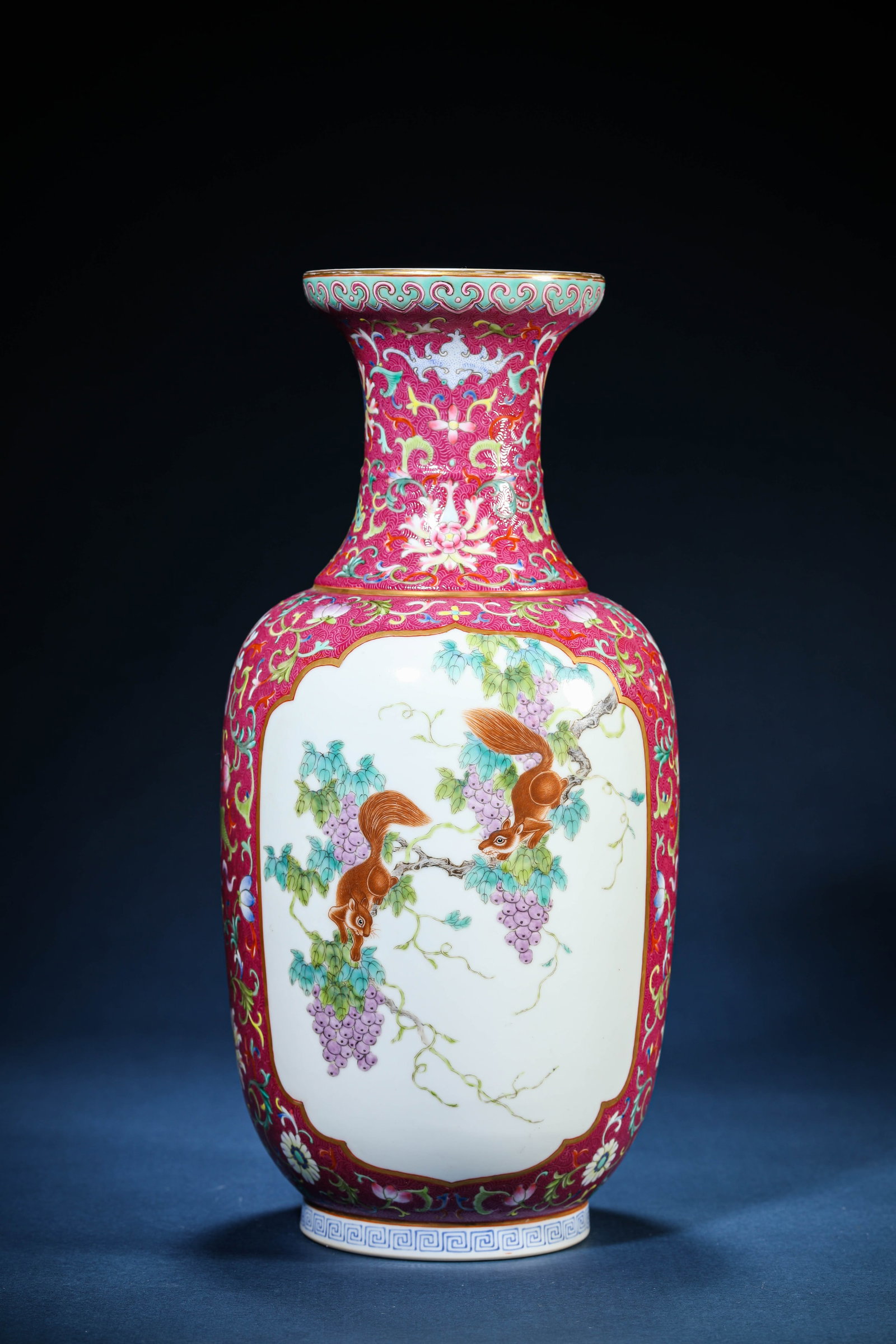A Famille-Rose 'Squirrel and Grape Reserves' Vase: A Famille-Rose 'Squirrel and Grape Reserves' Vase (15.1 x 32.5 cm)