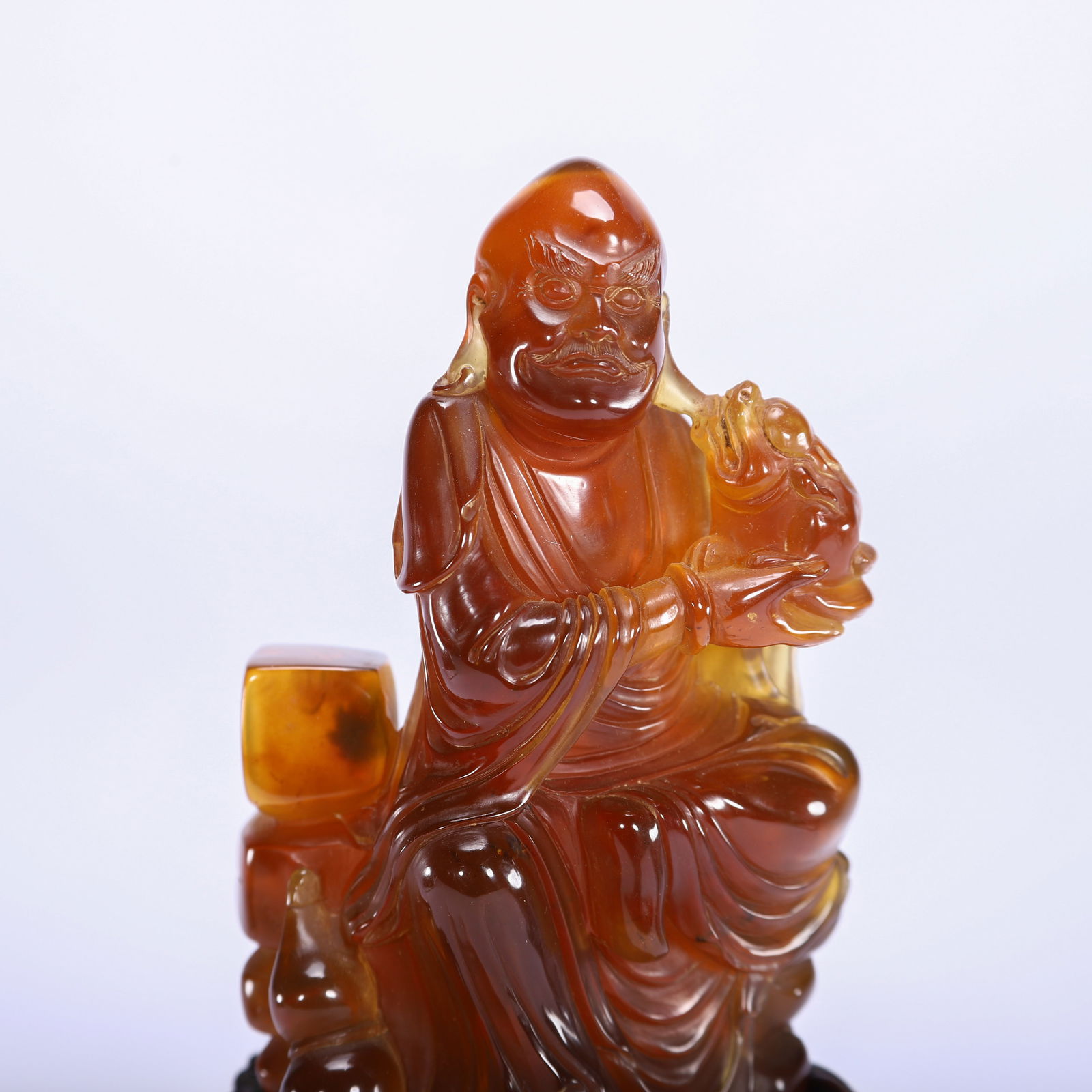 A CHINESE AMBER LUOHAN FIGURE - 2