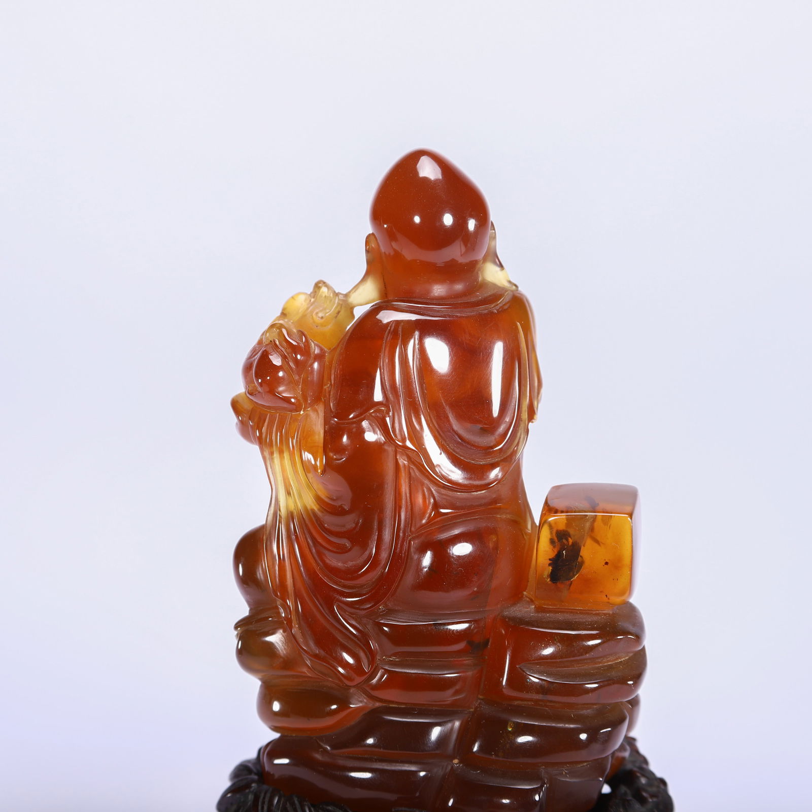 A CHINESE AMBER LUOHAN FIGURE - 8