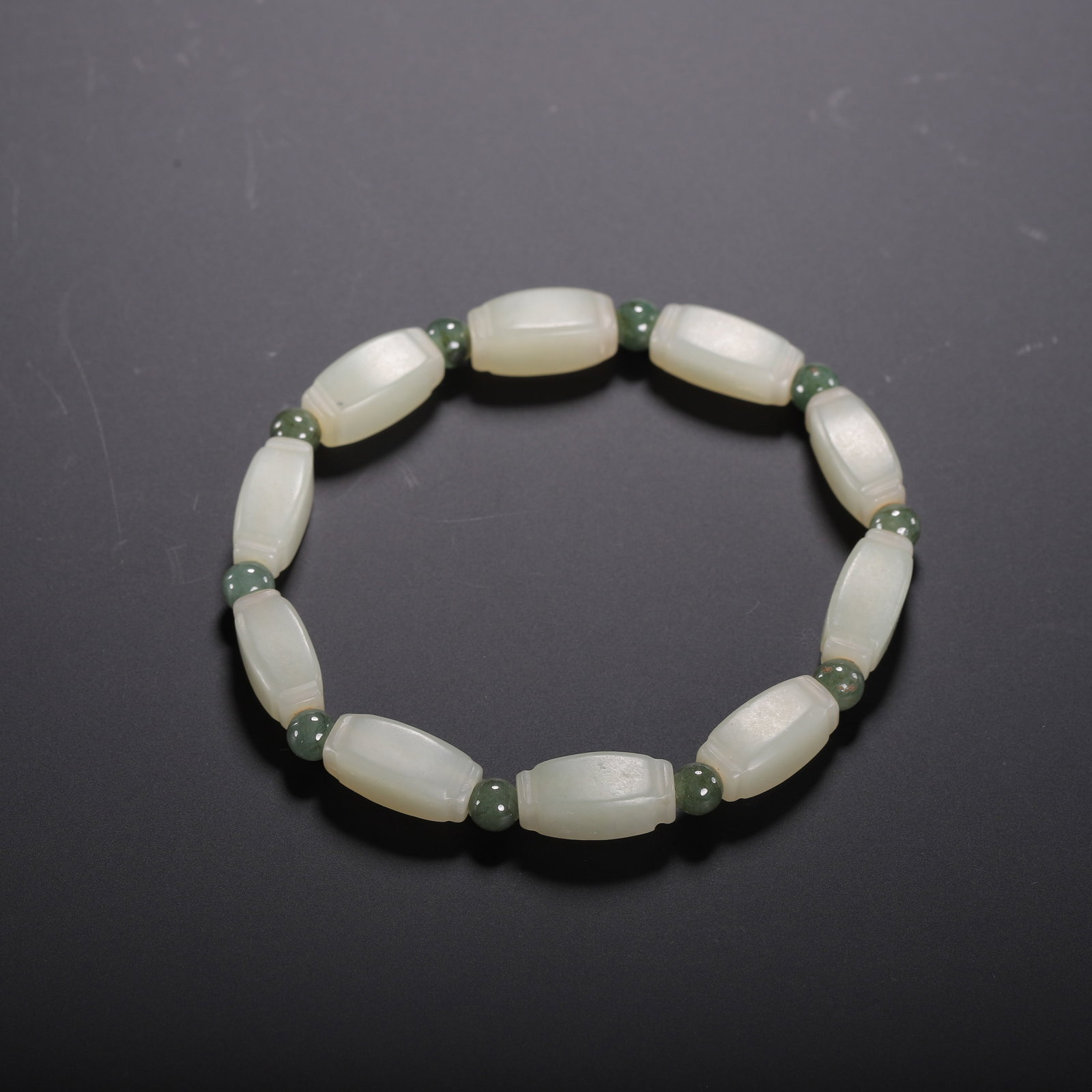 A CHINESE HETIAN JADE BRACELET WITH RECTANGULAR BEADS AND GREEN JADE SPACERS (1 of 9)