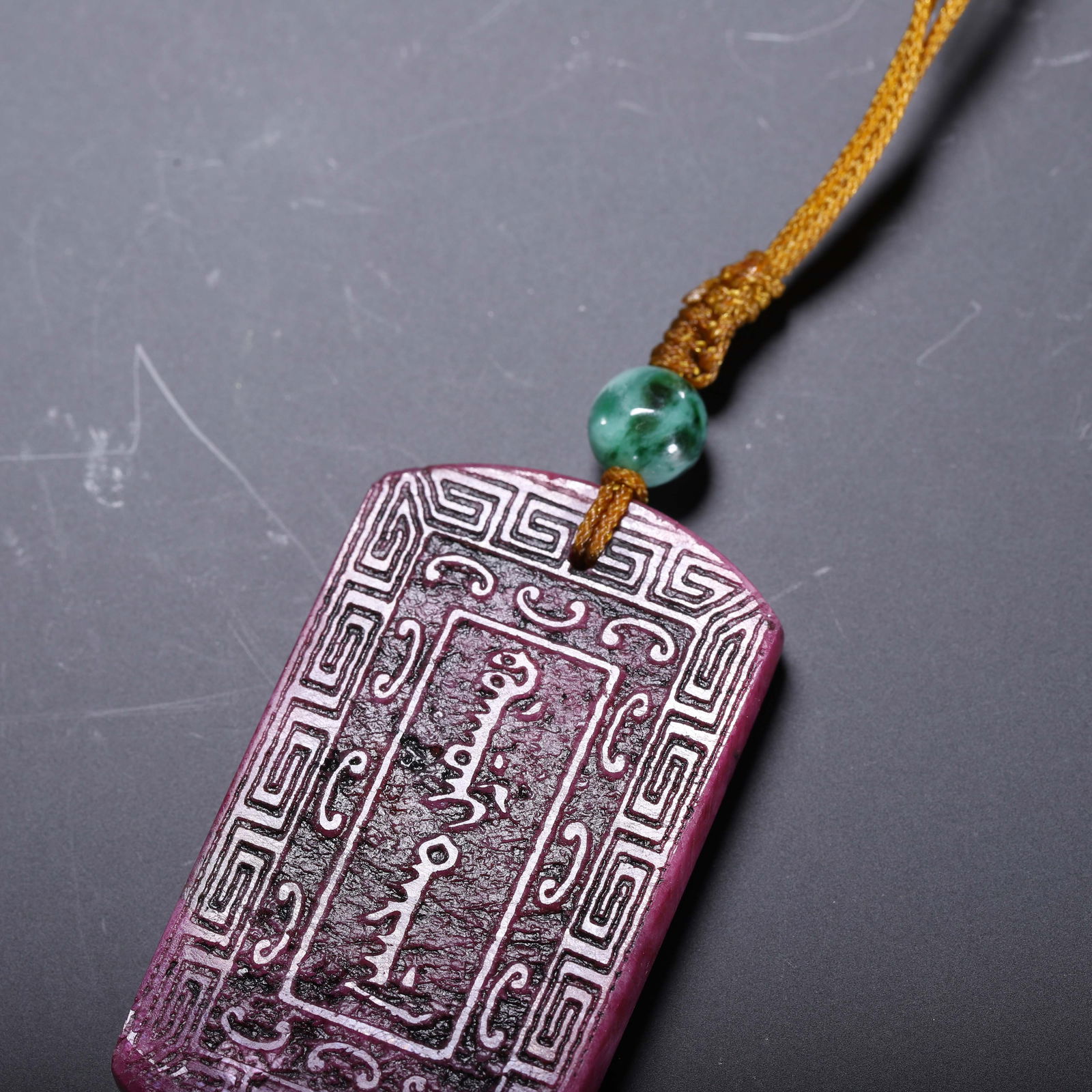 A CHINESE RUBY 'ZHAI JIE' PENDANT - 7