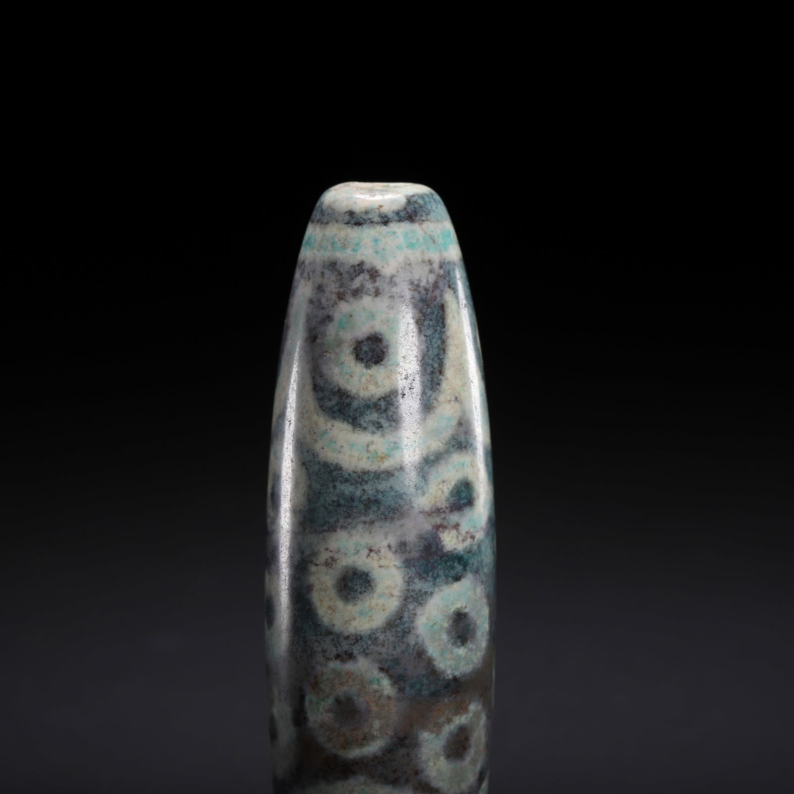 A CHINESE MULTI-EYED DZI BEAD - 2