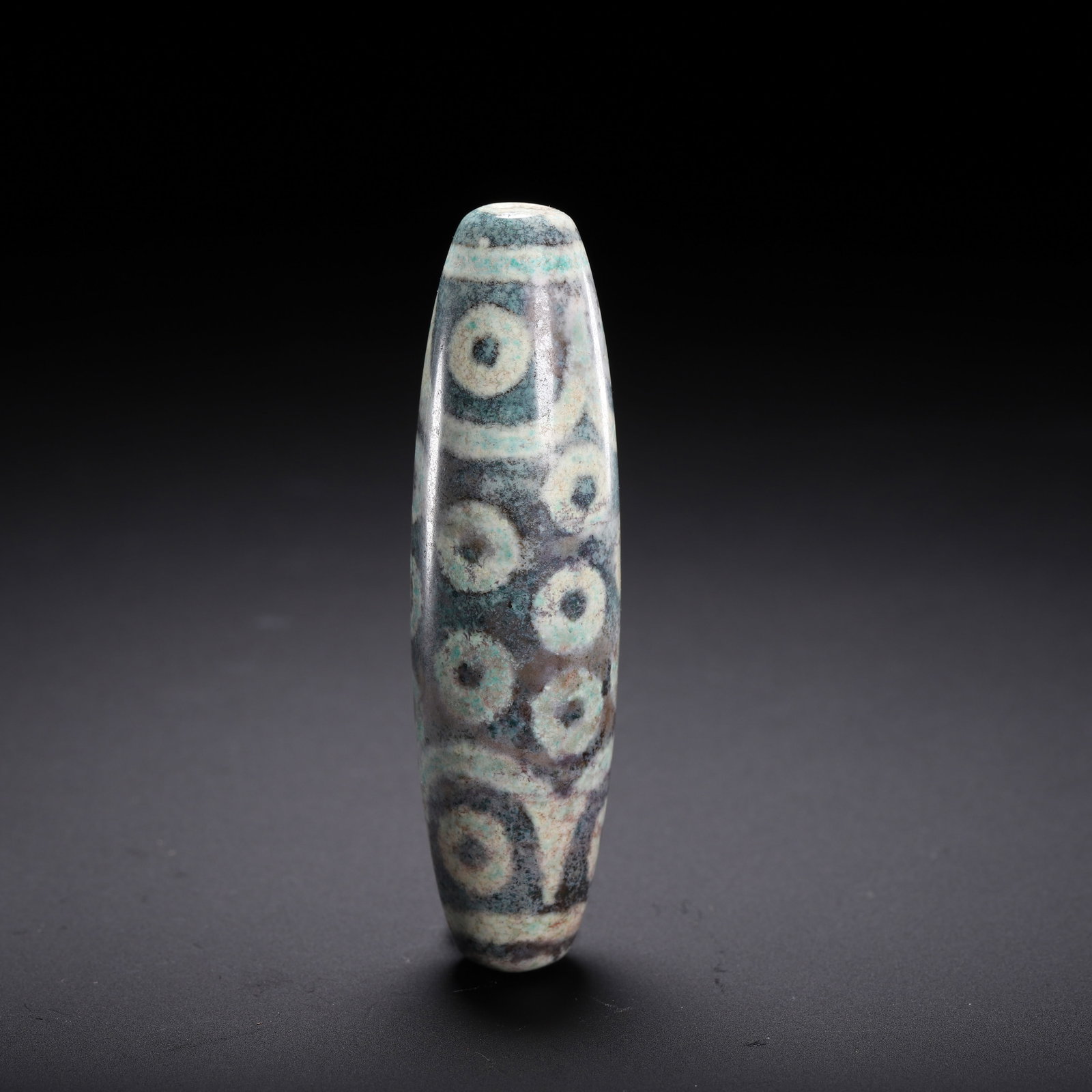 A CHINESE MULTI-EYED DZI BEAD - 6