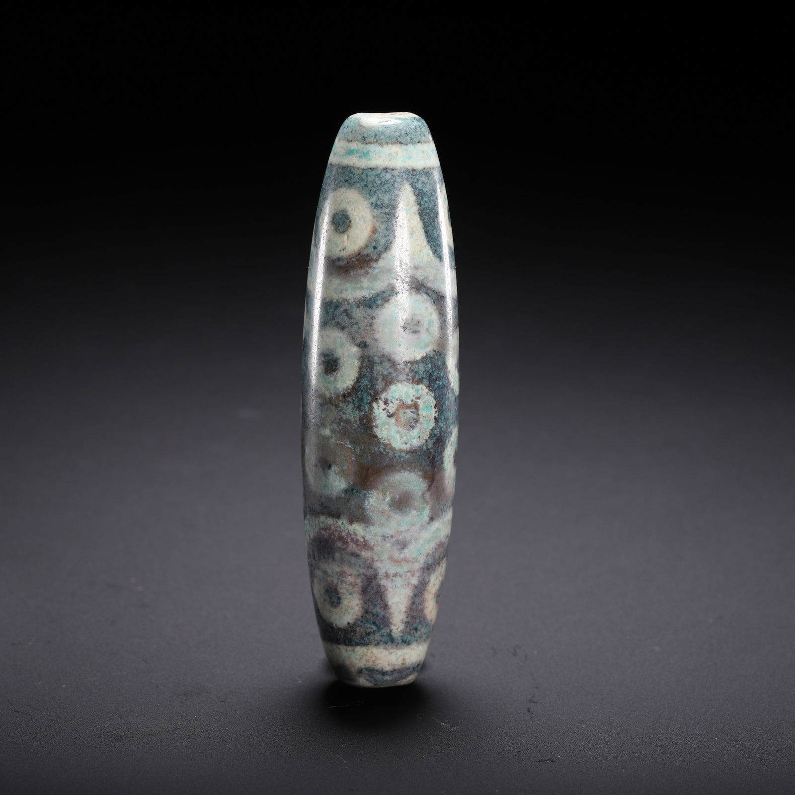 A CHINESE MULTI-EYED DZI BEAD - 7