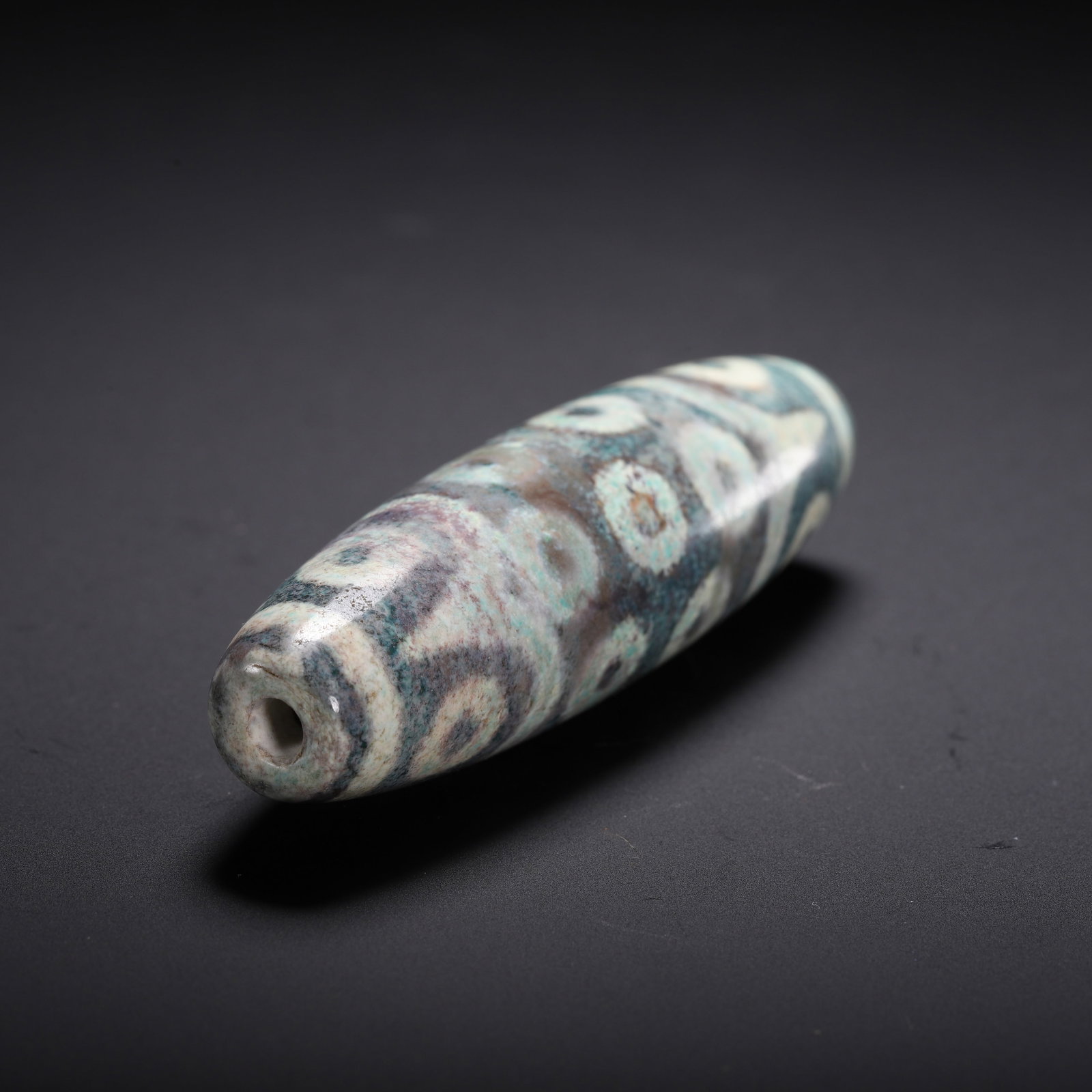 A CHINESE MULTI-EYED DZI BEAD - 9