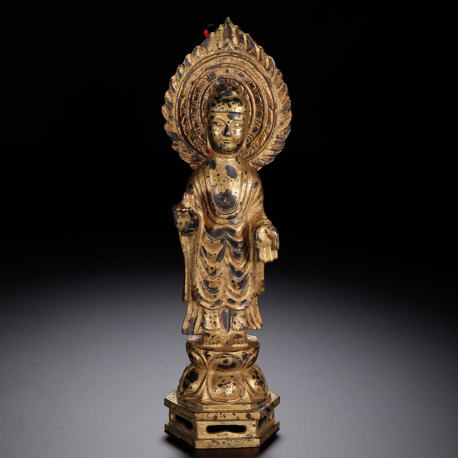 A CHINESE GILT-BRONZE STANDING BUDDHA STATUE WITH NIMBUS (1 of 9)
