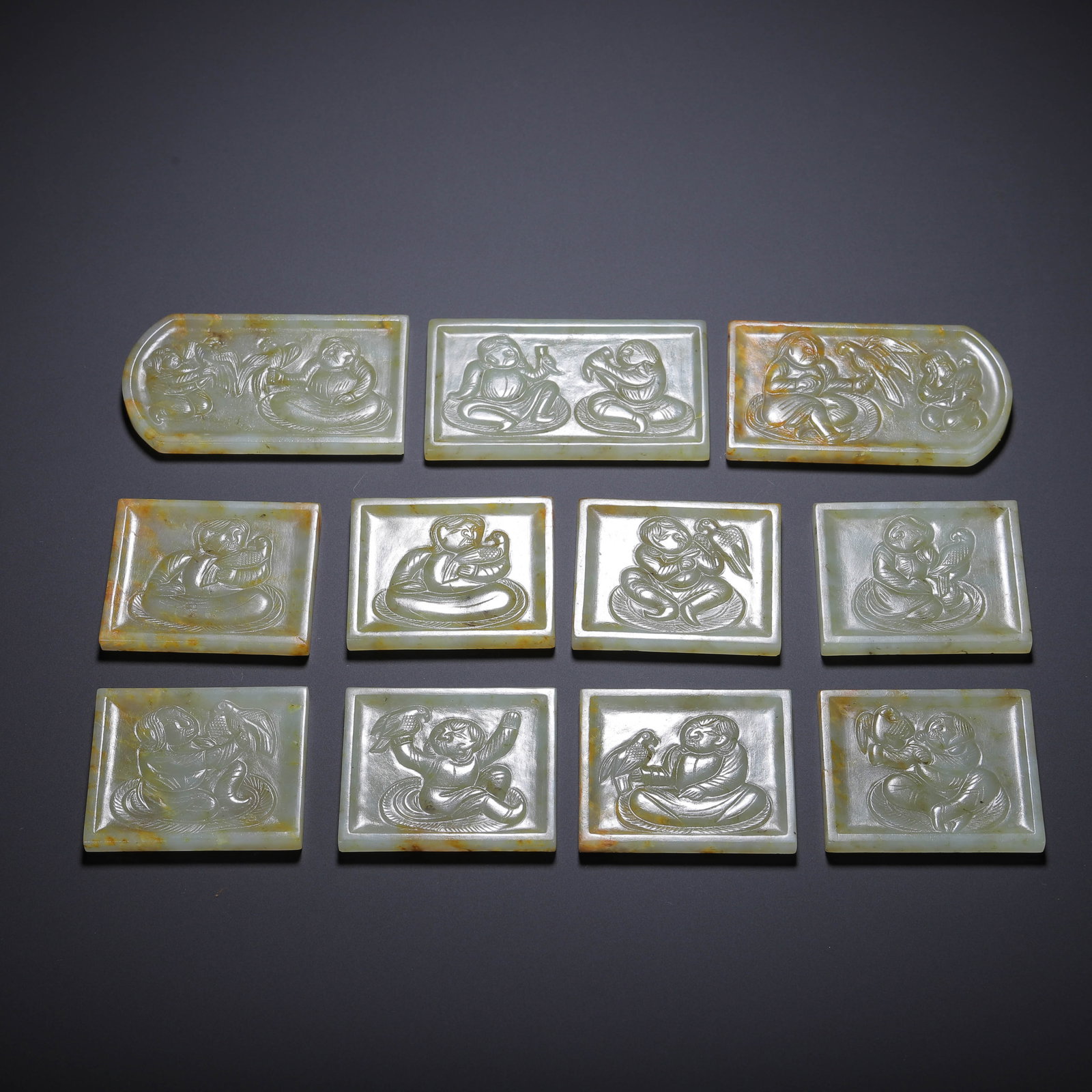 A SET OF CHINESE HETIAN JADE BELT PLAQUES WITH FIGURAL CARVINGS: A SET OF CHINESE HETIAN JADE BELT PLAQUES WITH FIGURAL CARVINGS (7 x 4cm)