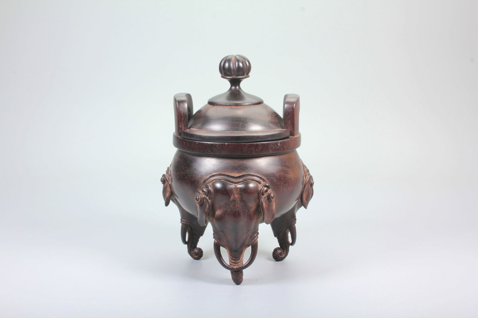 A RED SANDALWOOD CARVED INCENSE BURNER WITH ELEPHANT FEET: A RED SANDALWOOD CARVED INCENSE BURNER WITH ELEPHANT FEET H:17.8CM,D:11.1CM