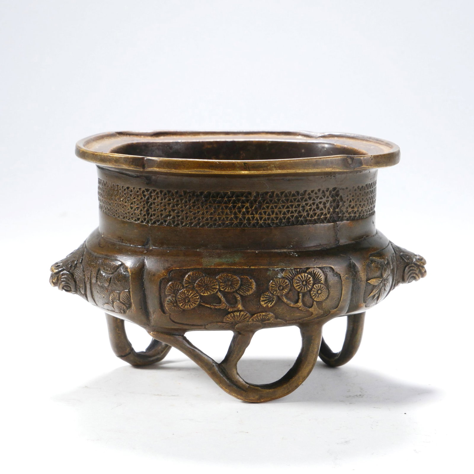 A BRONZE SIX-LEGGED CENSER WITH BEAST-FACE HANDLES AND PINE, BAMBOO AND PLUM BLOSSOM PATTERNS: A BRONZE SIX-LEGGED CENSER WITH BEAST-FACE HANDLES AND PINE, BAMBOO AND PLUM BLOSSOM PATTERNS H:7.5CM,W:12.5CM