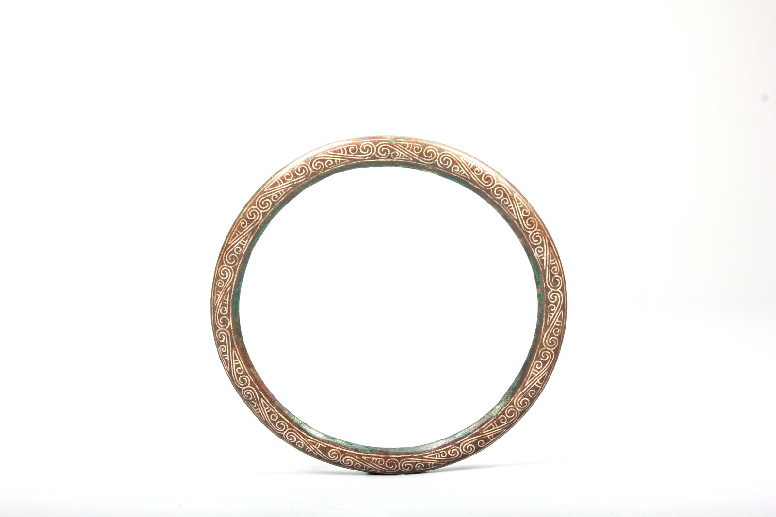 A SILVER-INLAID BRONZE LOOP - 5