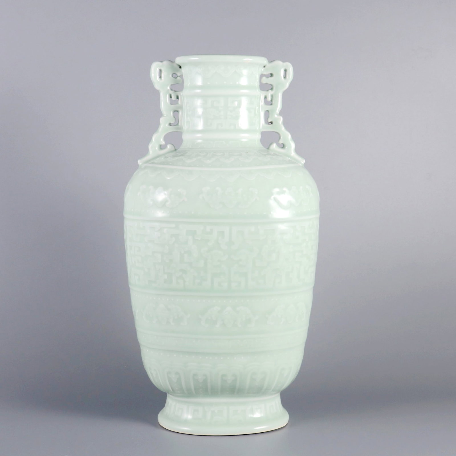 A CELADON GLAZED VASE WITH CARVED KUI DRAGON AND TWO EARS: A CELADON GLAZED VASE WITH CARVED KUI DRAGON AND TWO EARS H:34.6CM,D:17.5CM