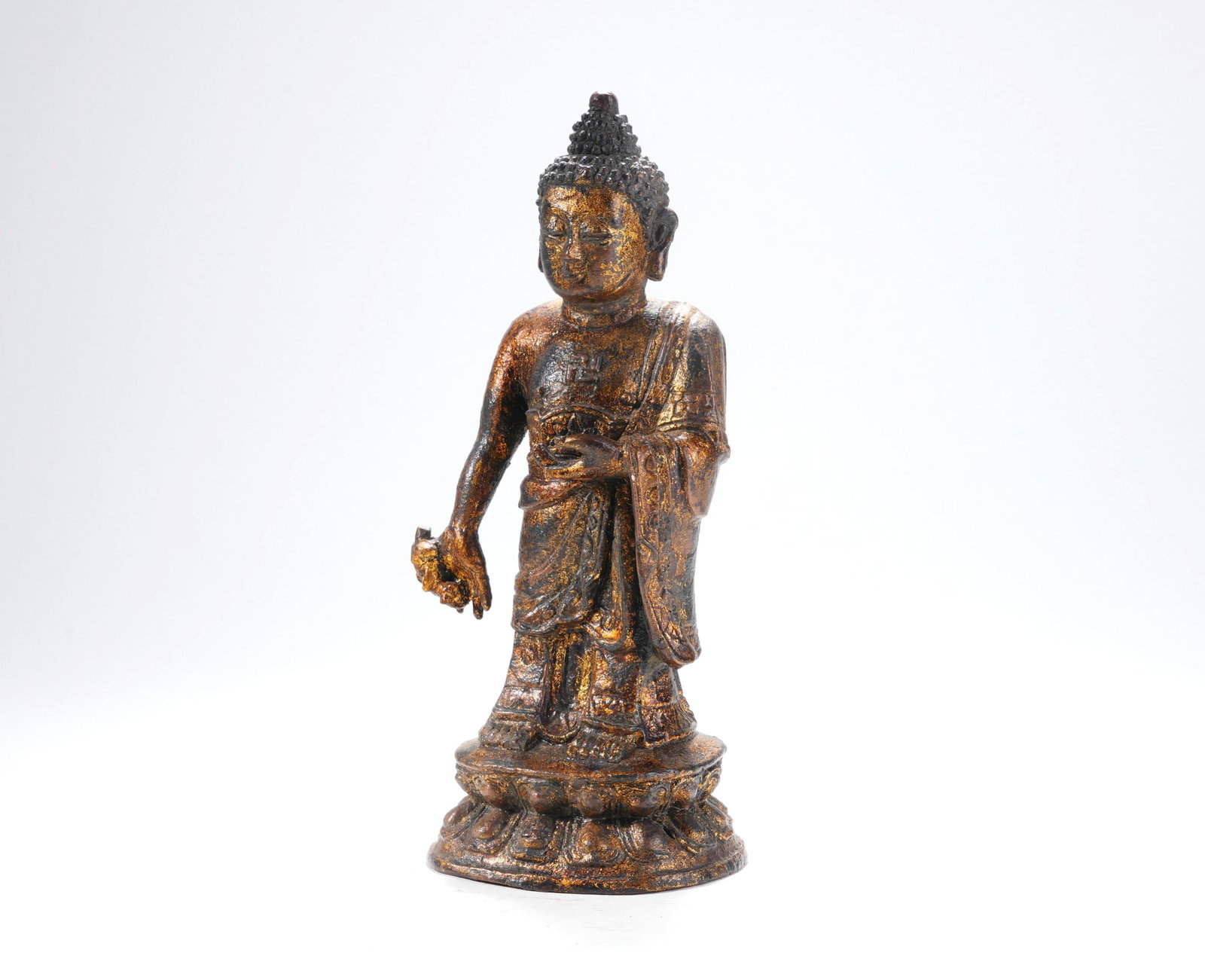 A BRONZE-BODY LACQUERED AND GILDED STANDING STATUE OF SAKYAMUNI BUDDHA: A BRONZE-BODY LACQUERED AND GILDED STANDING STATUE OF SAKYAMUNI BUDDHA H:18.5CM,W:8CM
