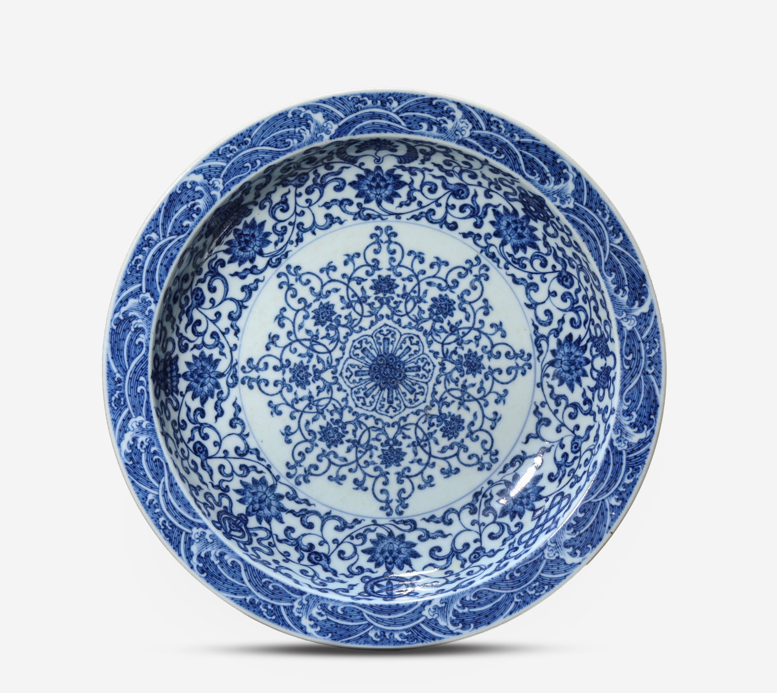 A Blue and White 'Interlocking Lotus and Eight Buddhist Emblems' Dish: A Blue and White 'Interlocking Lotus and Eight Buddhist Emblems' Dish (28.5 x 5.5cm)