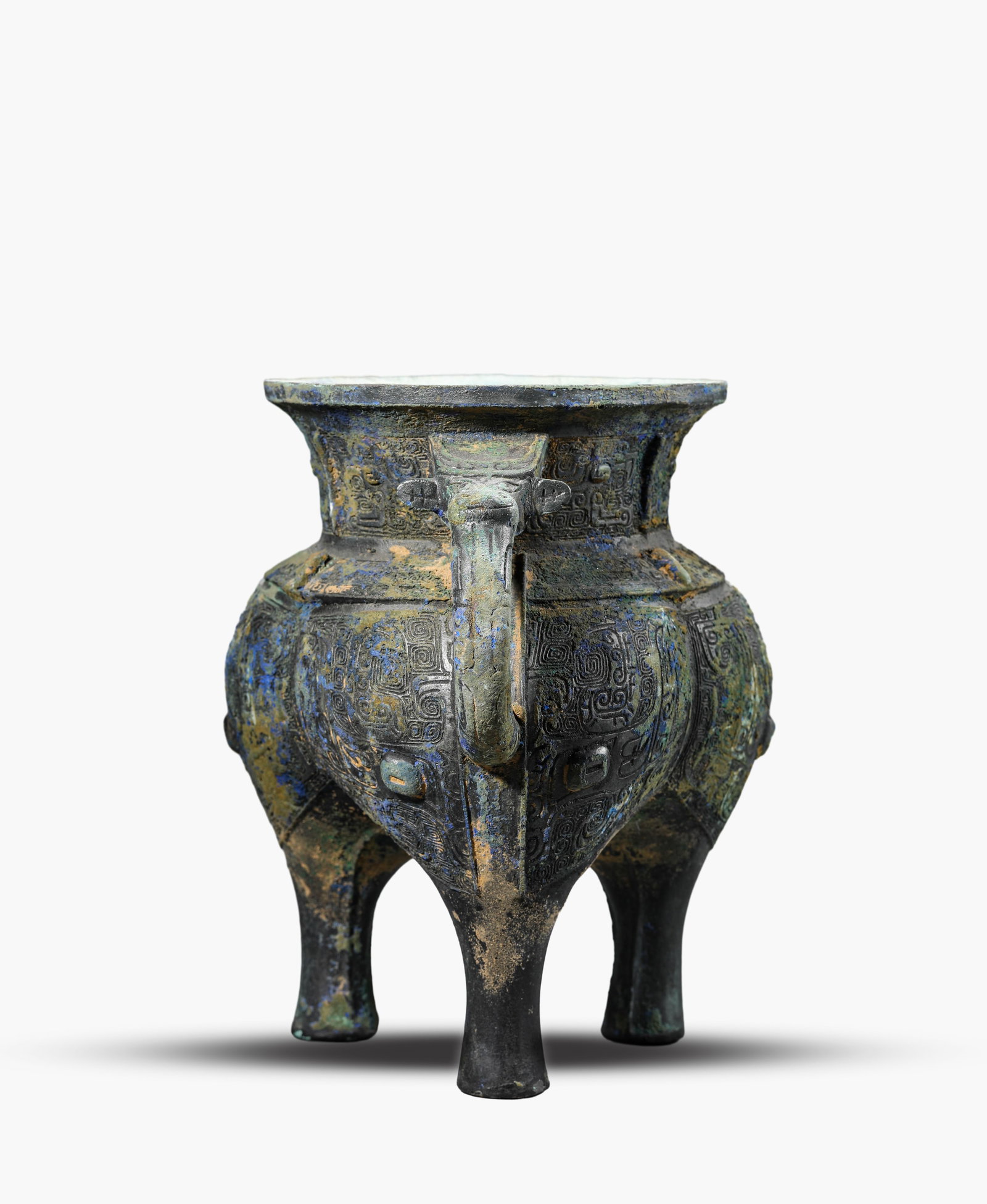 A Bronze 'Taotie' Jia Tripod: A Bronze 'Taotie' Jia Tripod (24.3 x 18.7 x 23.7cm,Weight 3457g)