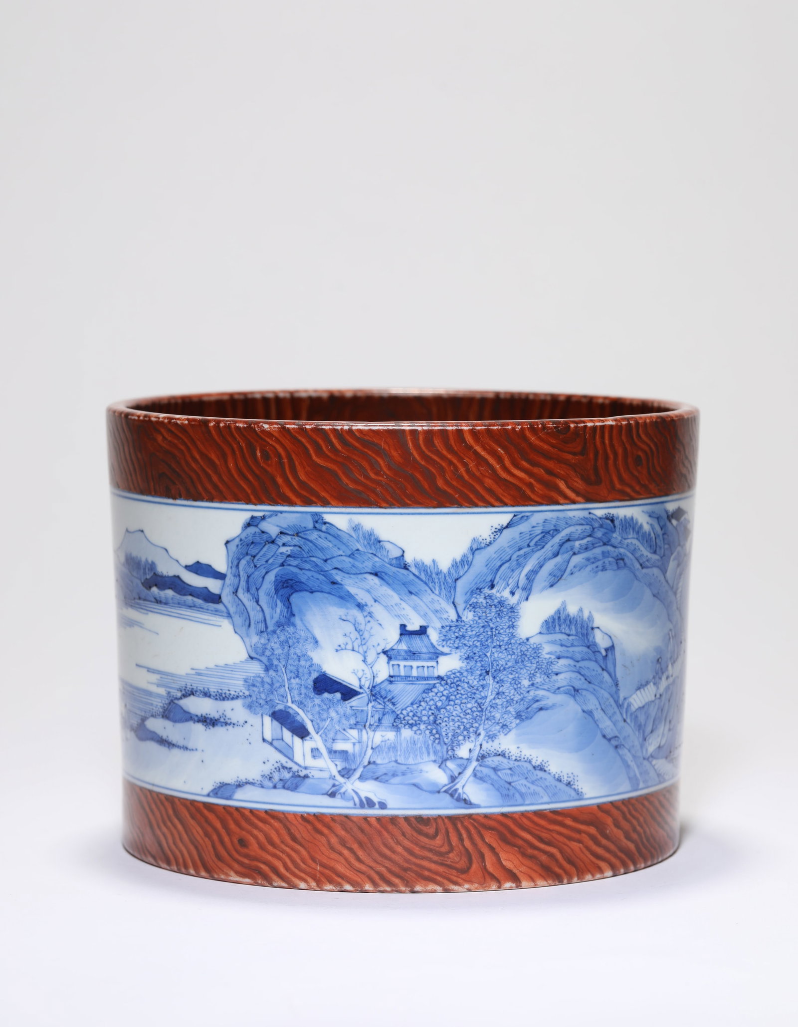 A 'Wood-Grain-Glazed' Blue and White 'Landscape and Figures' Brush Pot (1 of 4)