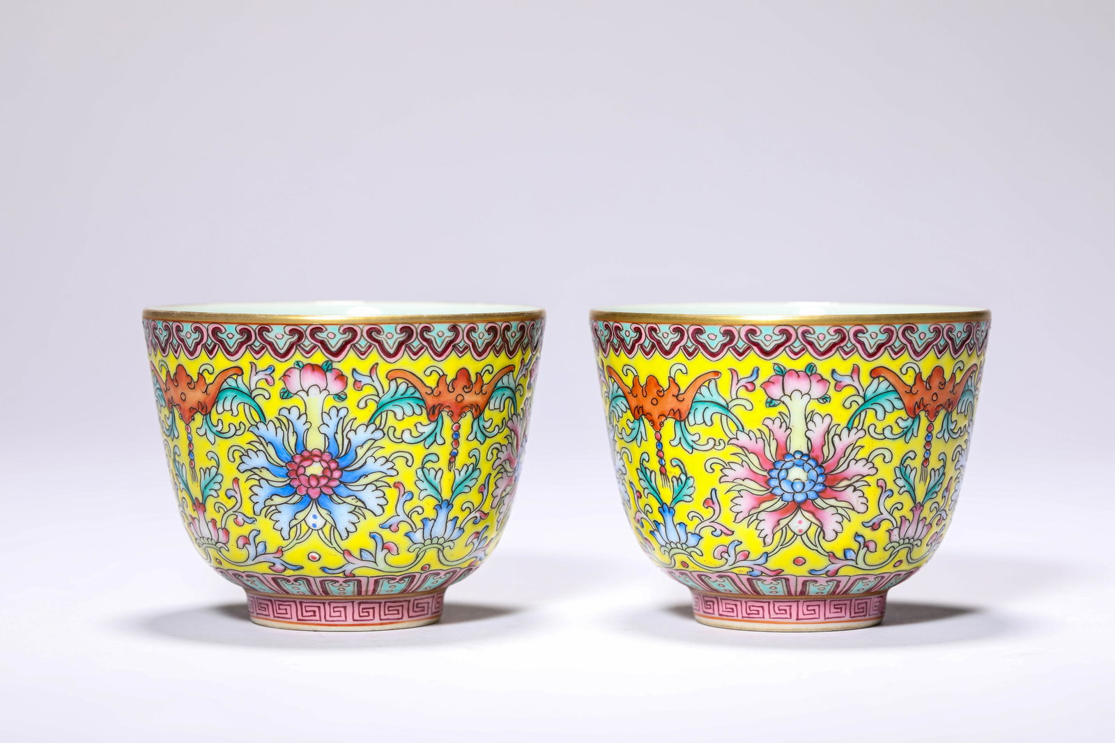 A Pair of Lemon-Yellow-Ground Famille-Rose 'Interlocking Lotus' Cups: A Pair of Lemon-Yellow-Ground Famille-Rose 'Interlocking Lotus' Cups (7.8 x 6.2cm)