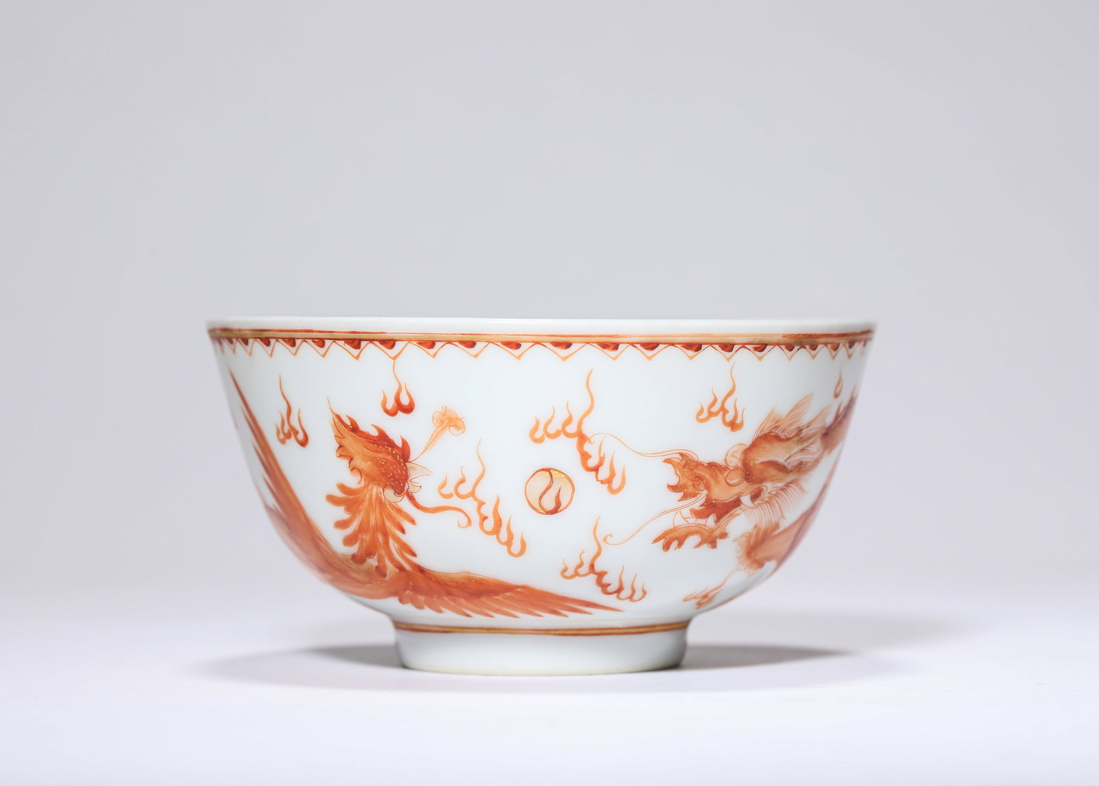 An Iron-Red 'Dragon and Phoenix' Bowl: An Iron-Red 'Dragon and Phoenix' Bowl (11.3 x 6cm)